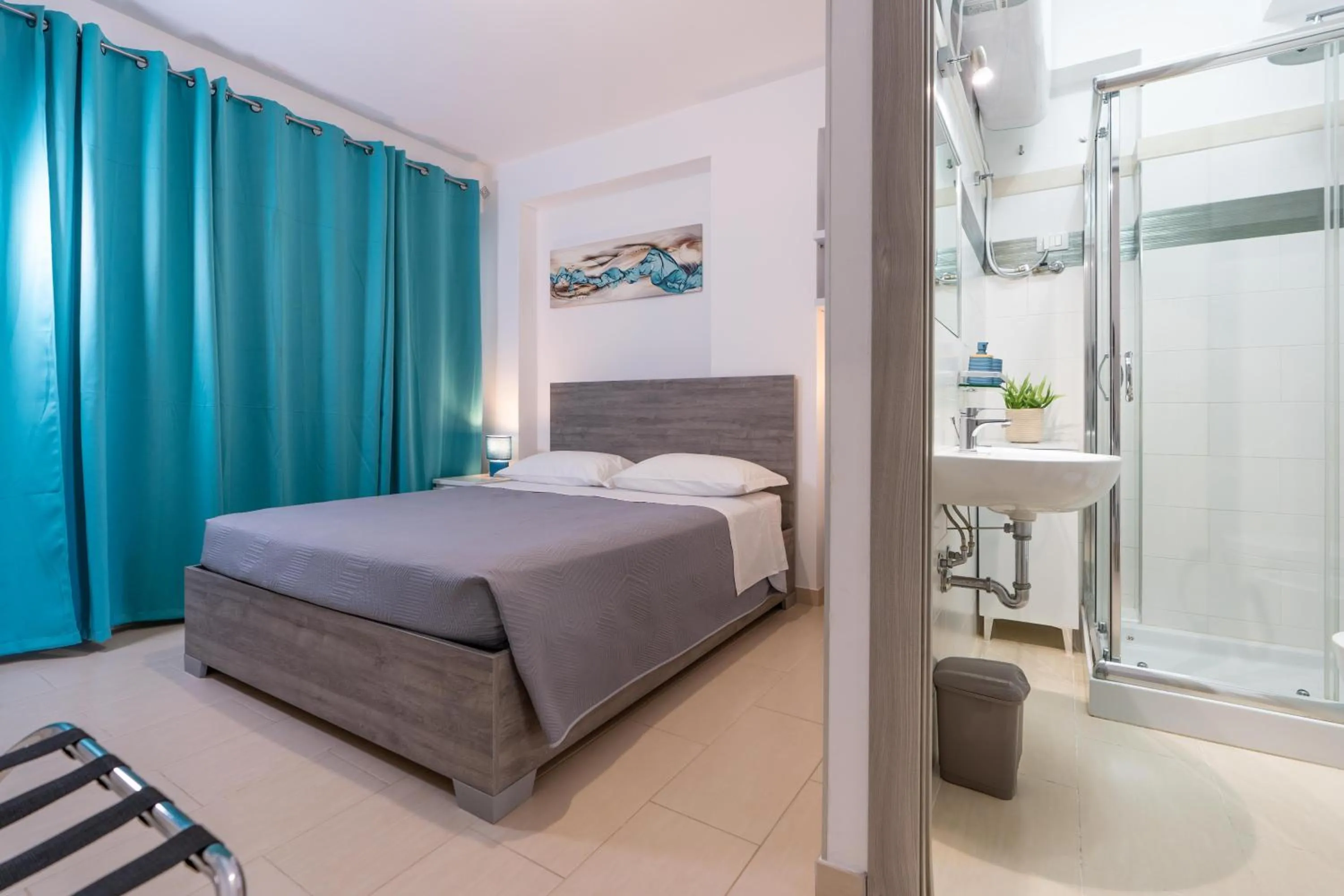 Bed in MADAGÌ Beachfront Apartments