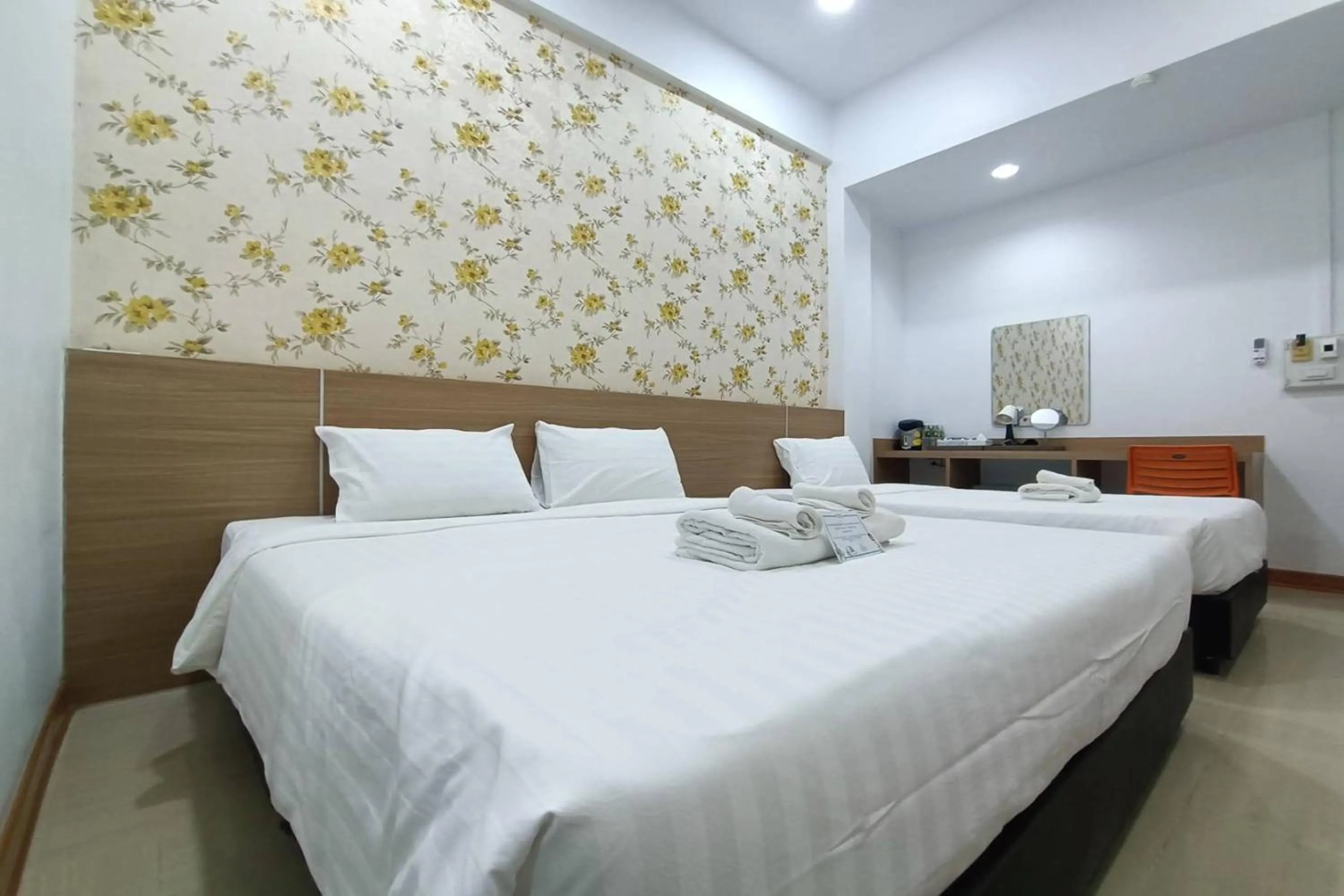 Bed in Top Inn Hotel