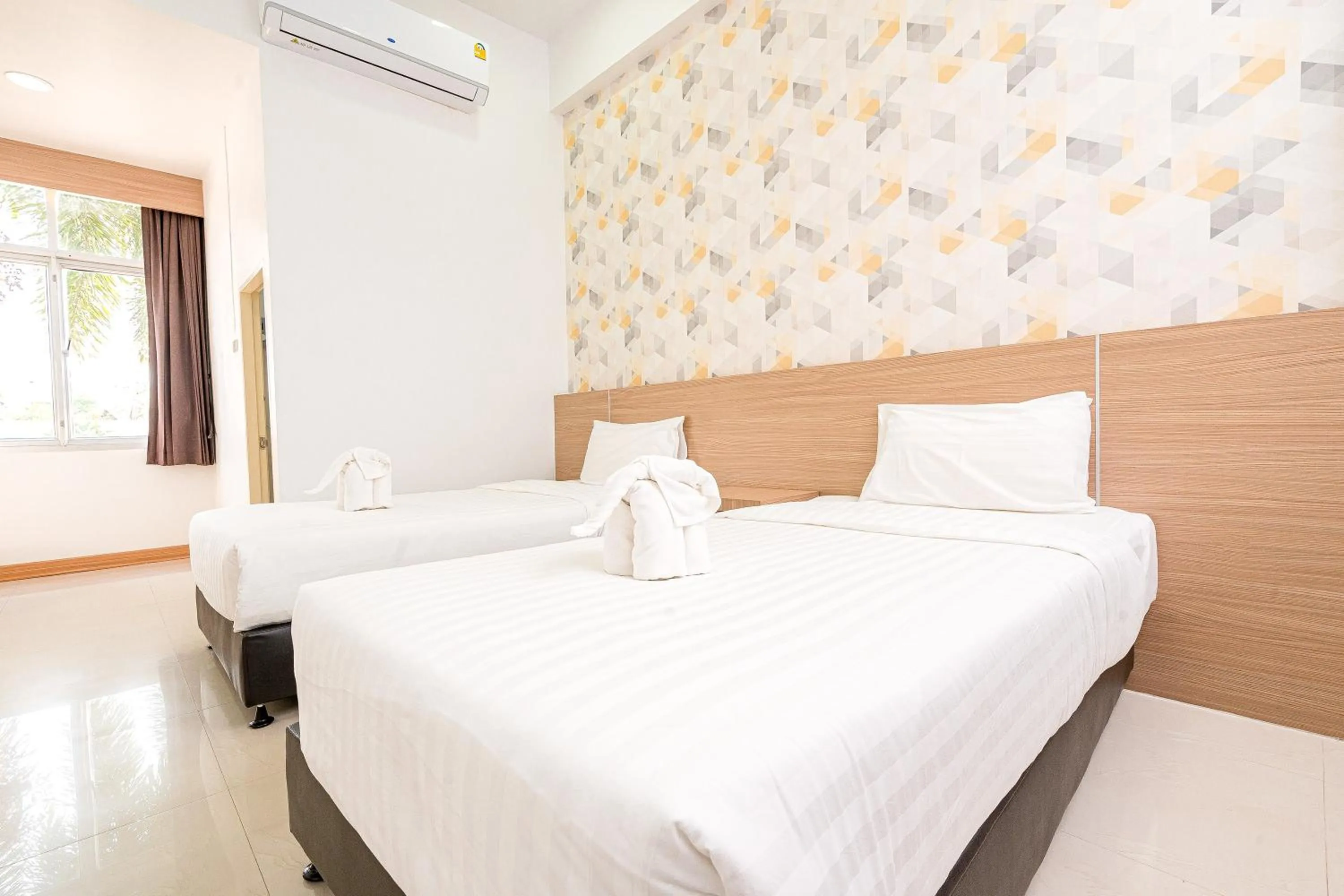 Bed in Top Inn Hotel