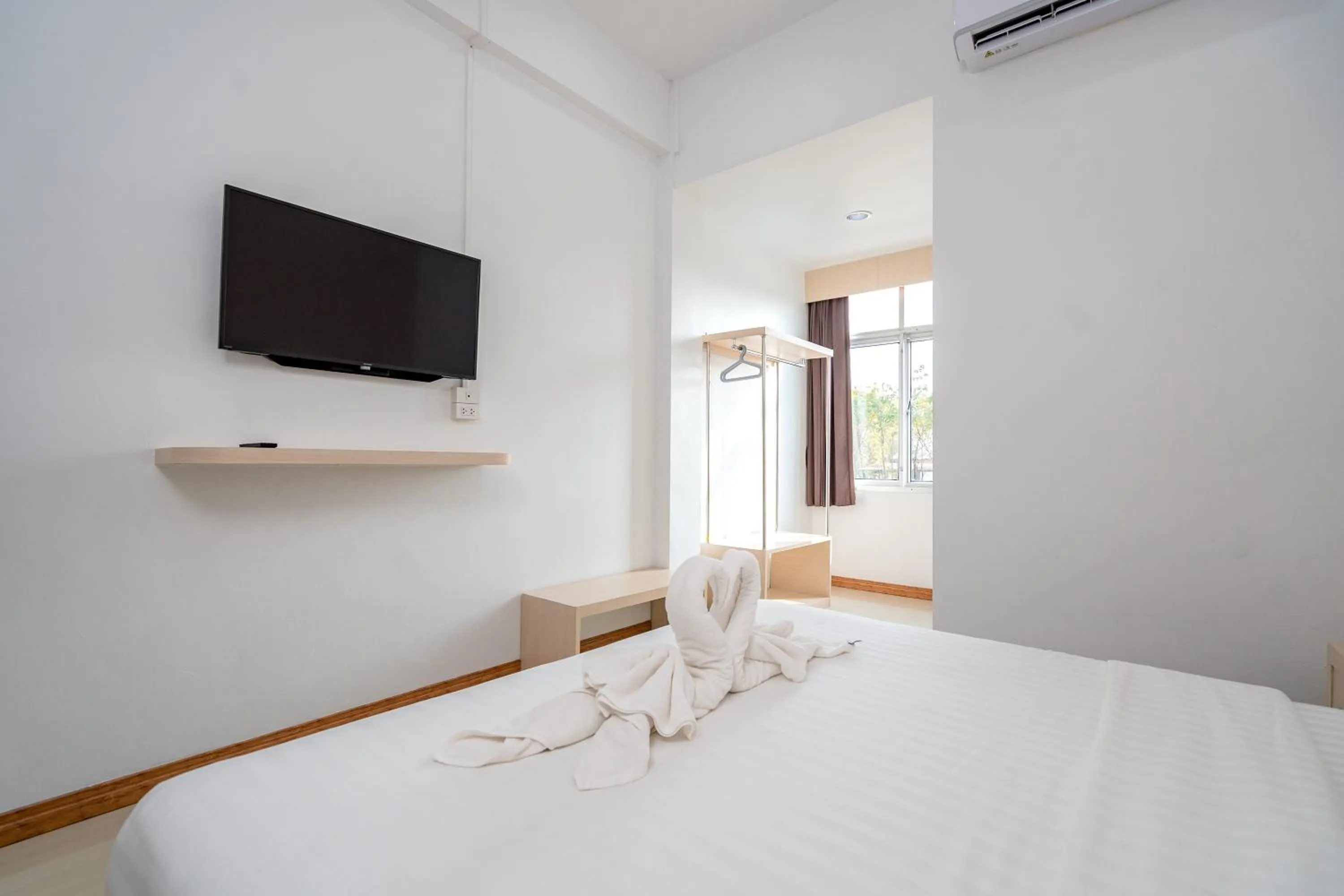 Bed in Top Inn Hotel