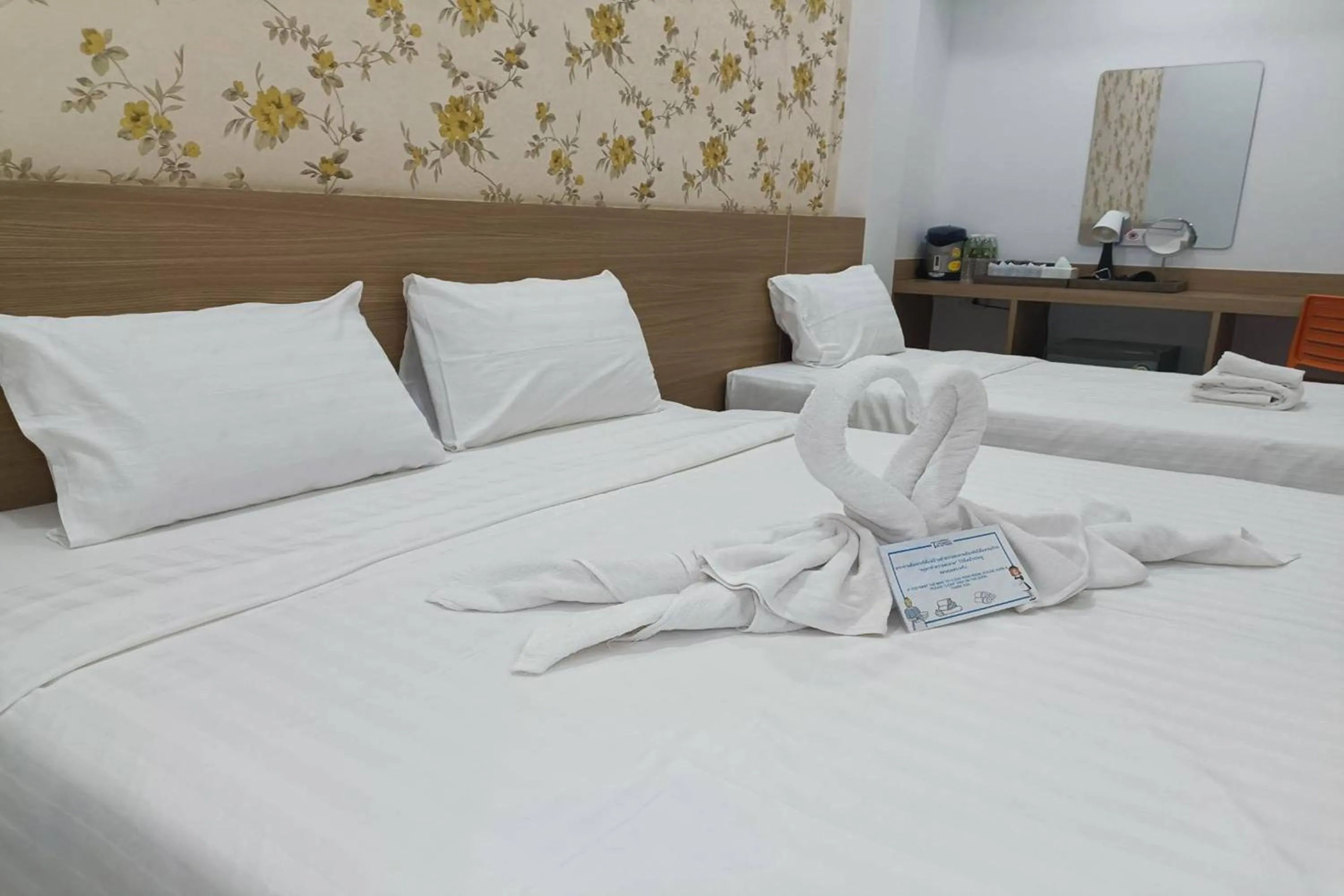 Bed in Top Inn Hotel