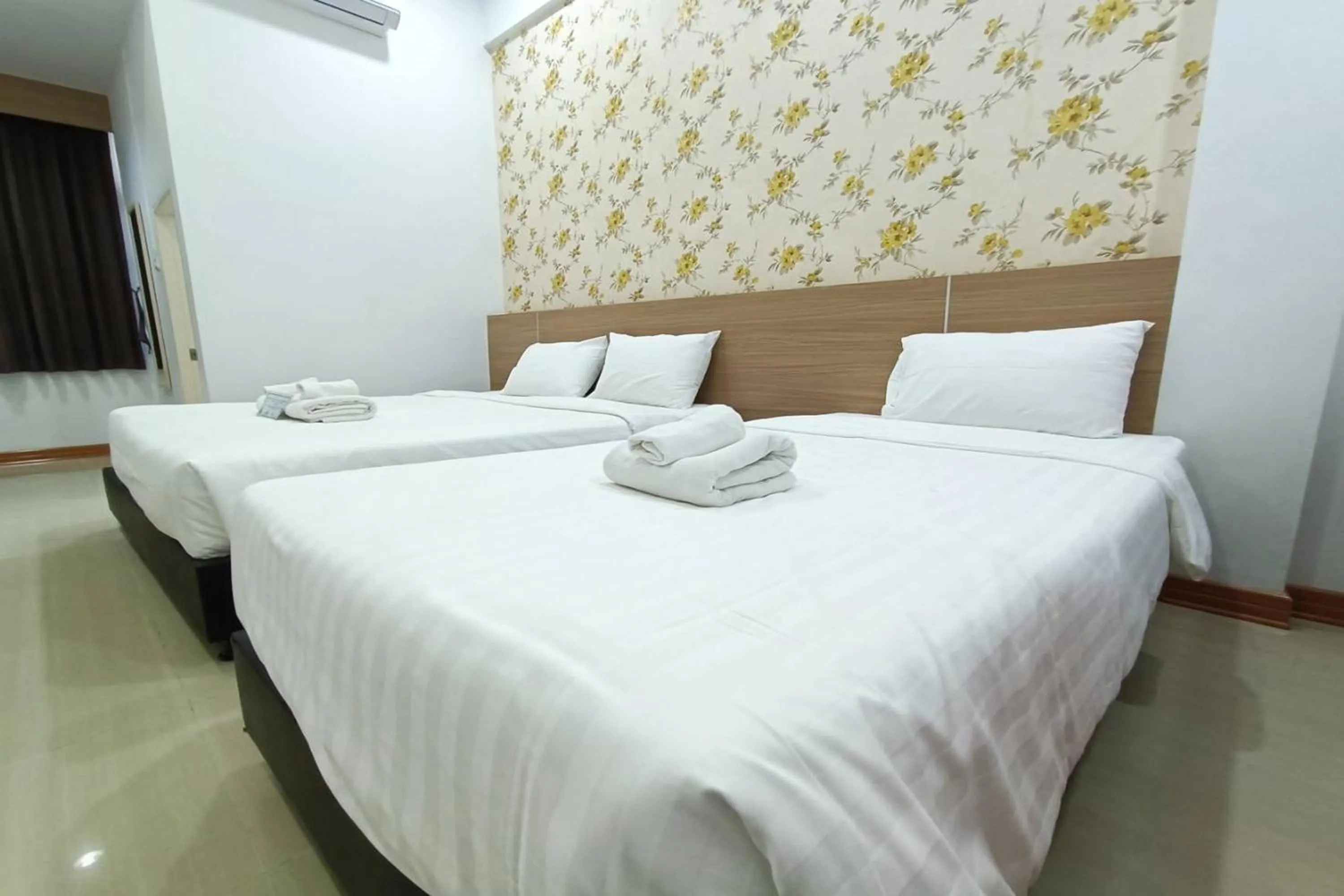 Bed in Top Inn Hotel