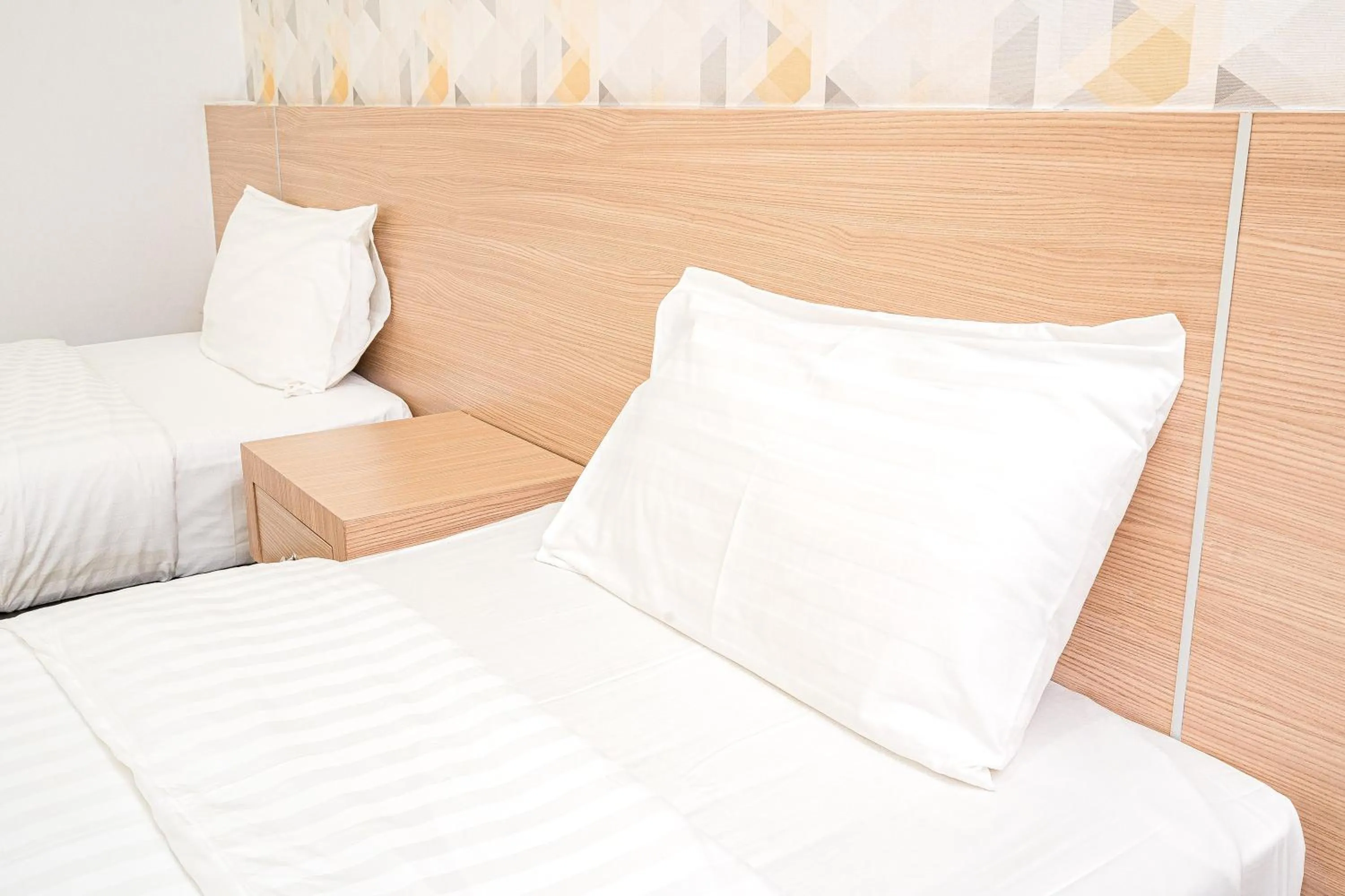 Bed in Top Inn Hotel