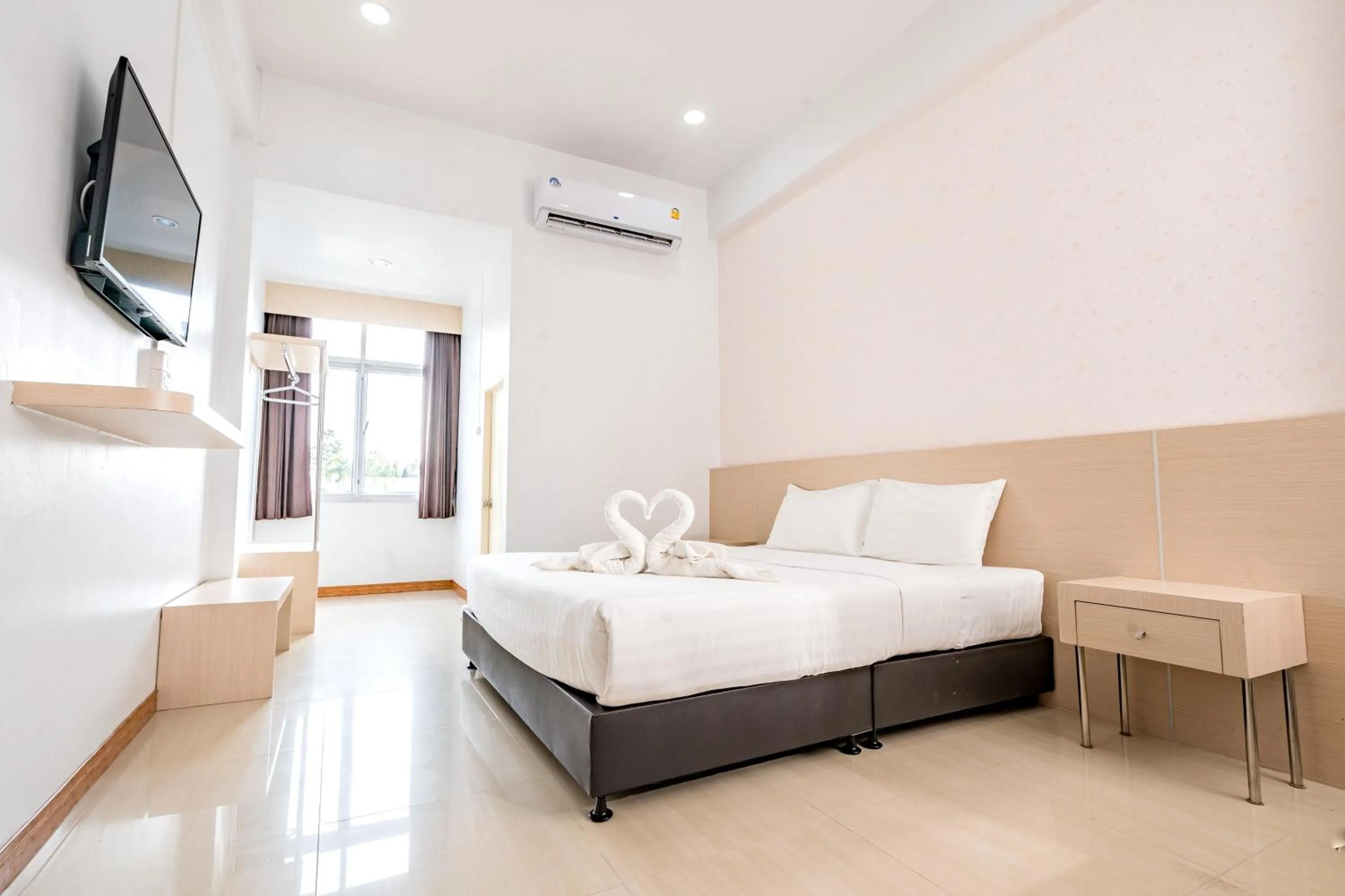 Bed in Top Inn Hotel