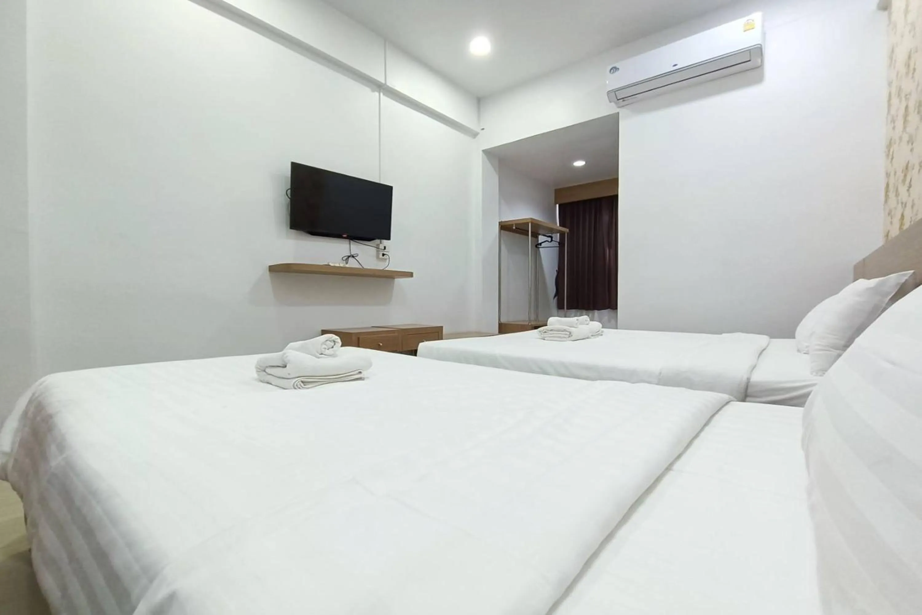 Bed in Top Inn Hotel