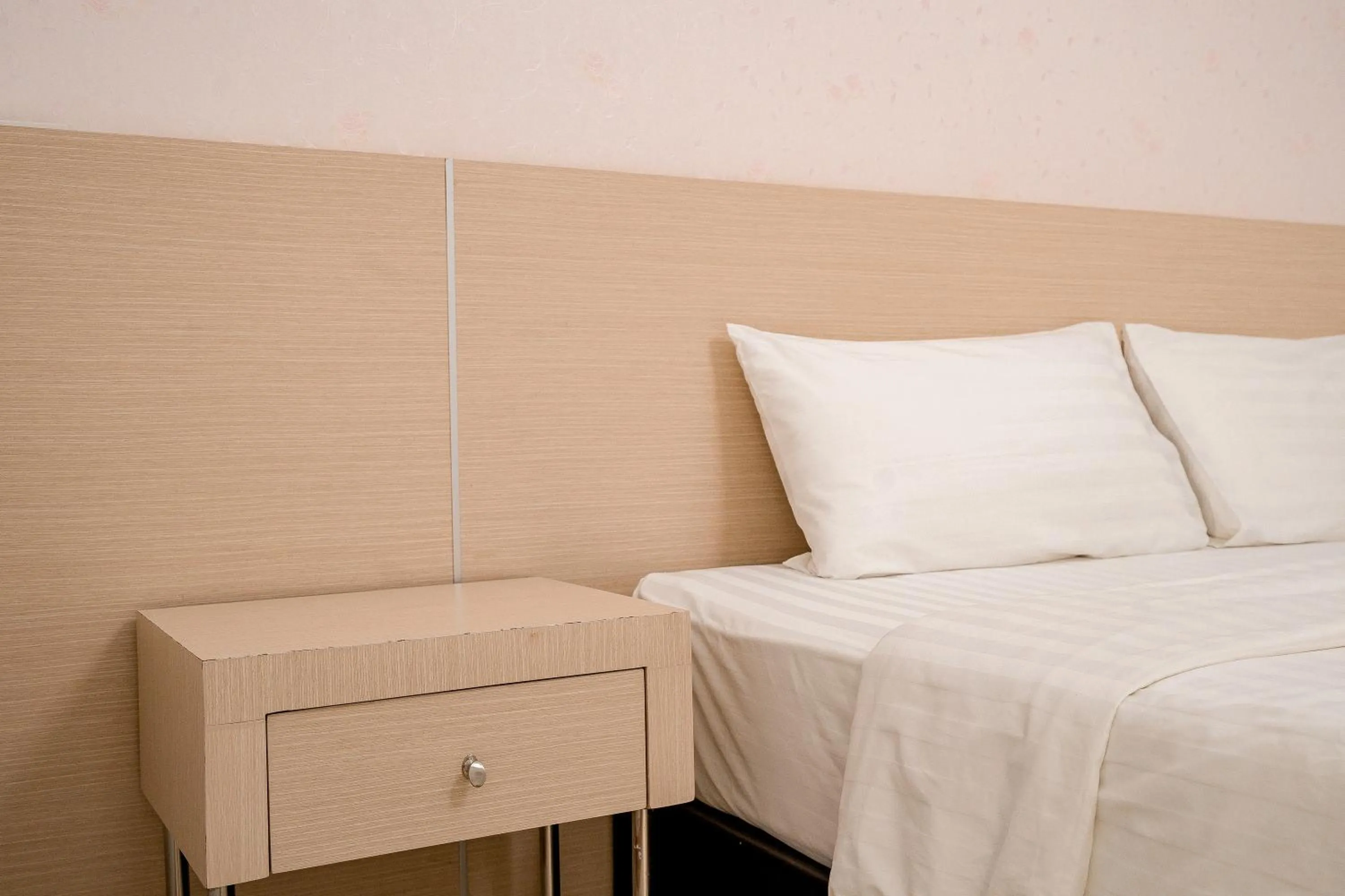 Bed in Top Inn Hotel