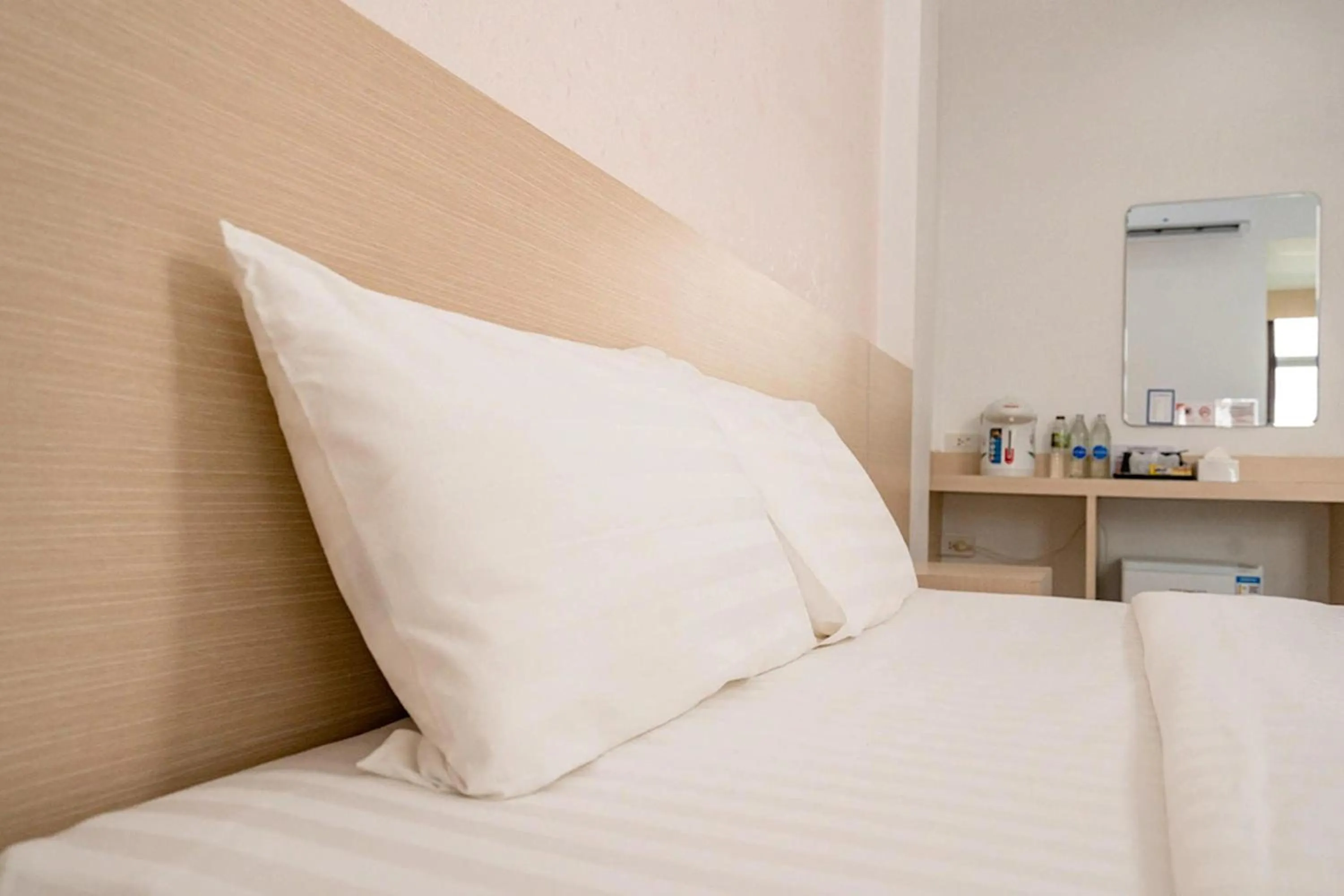 Bed in Top Inn Hotel