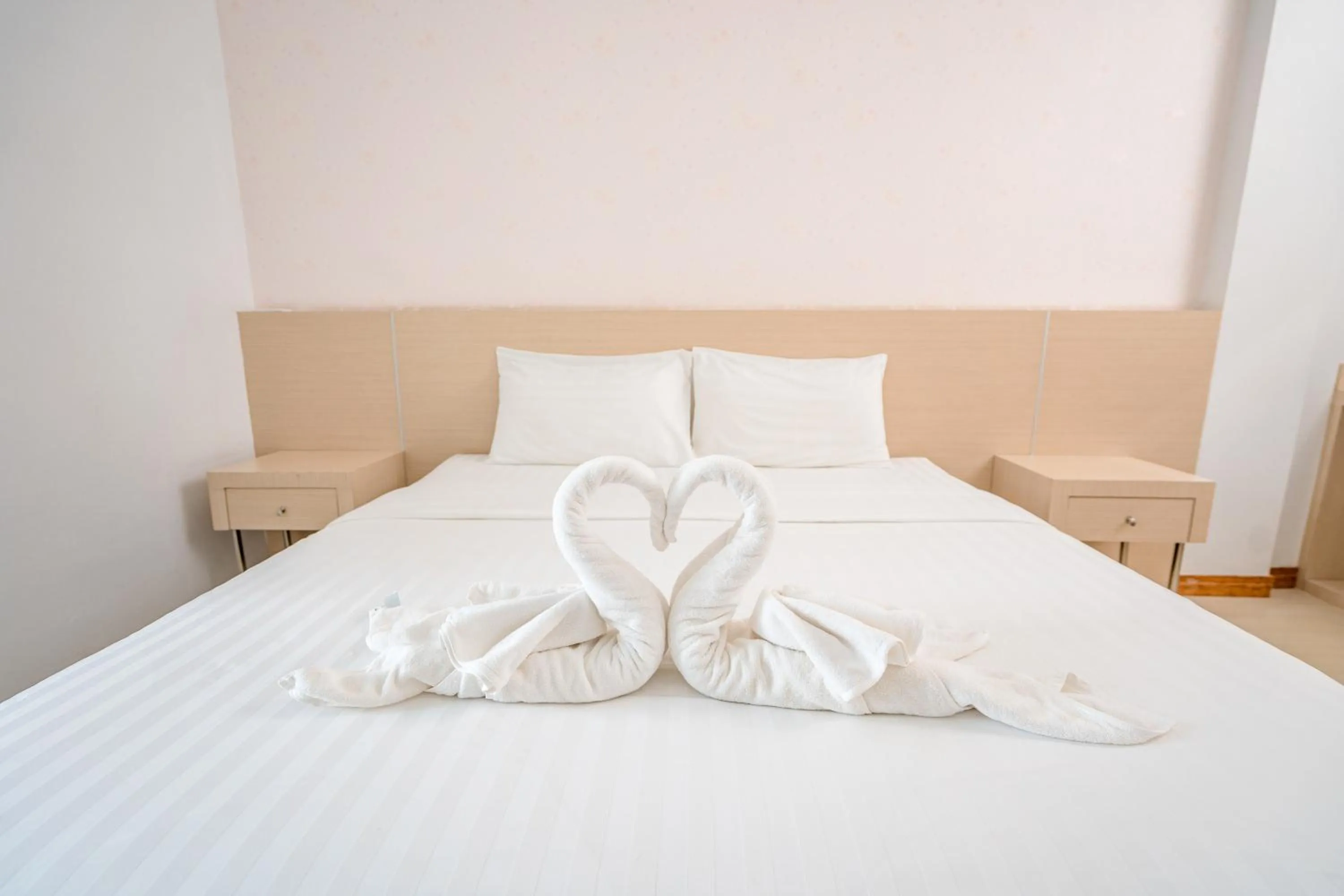 Bed in Top Inn Hotel