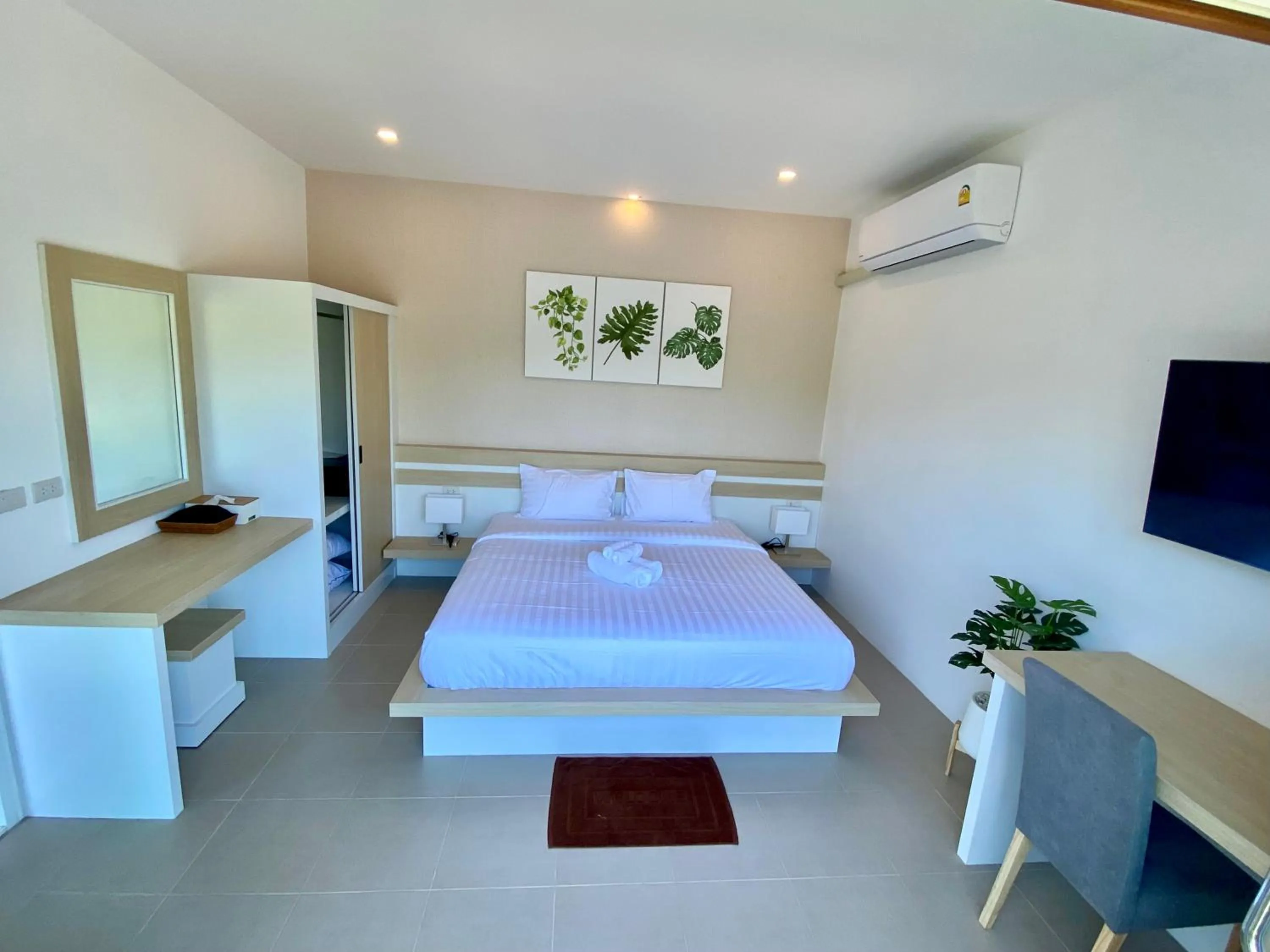 air conditioner, Bed in Pure Laguna Residence by Nice Sea Resort