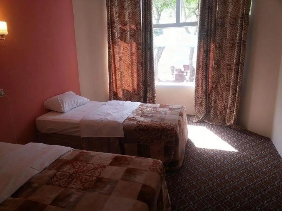 Bed in Hunza Panorama Hotel