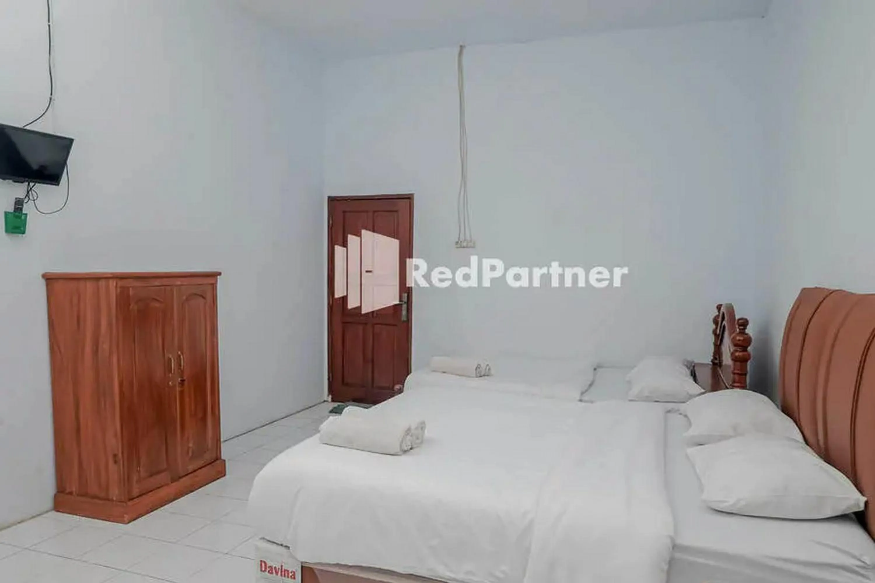 Bed in Pondok Damai Guest House Syariah Mitra RedDoorz