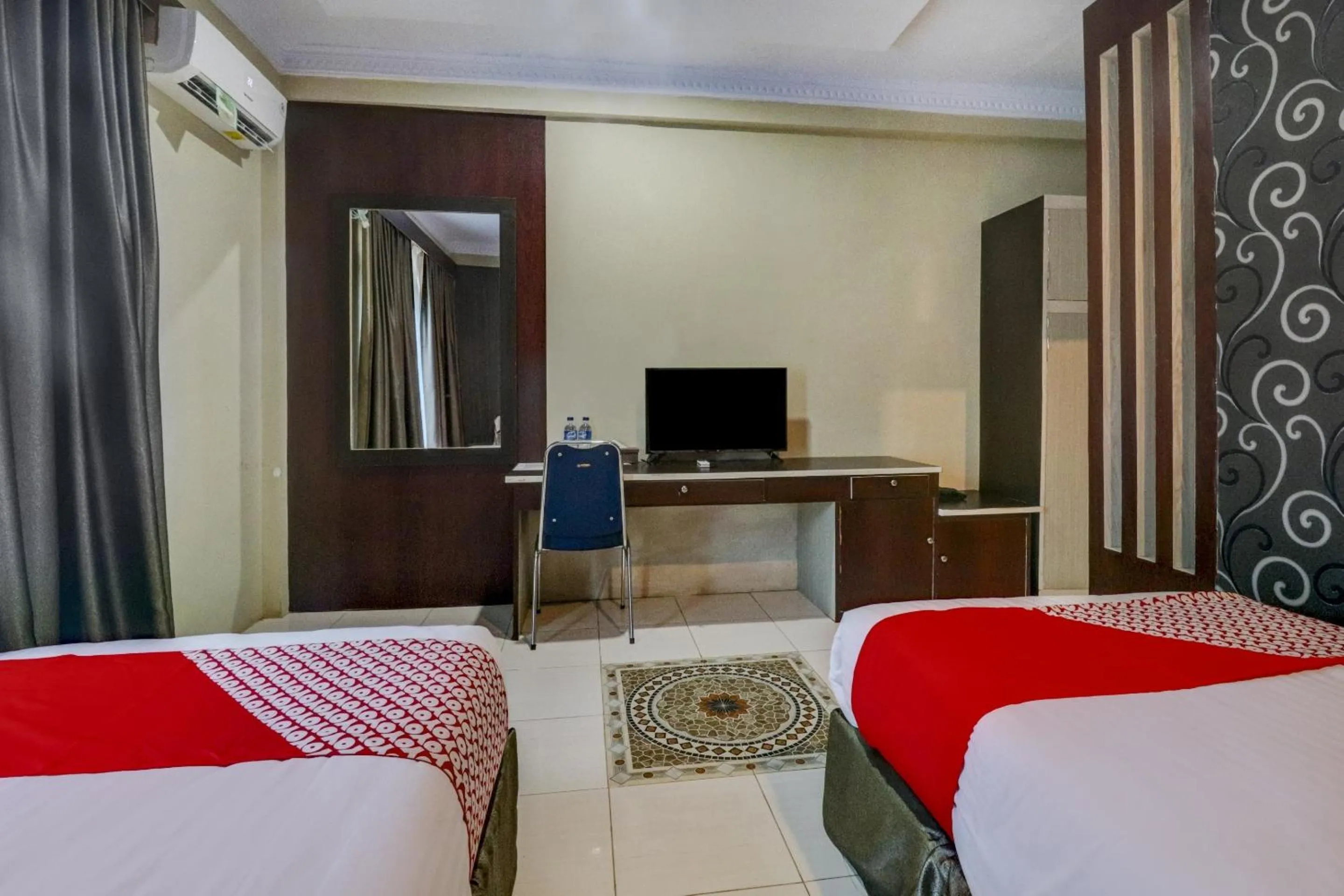 Bedroom in Collection O 90564 Hotel Merangin Syariah