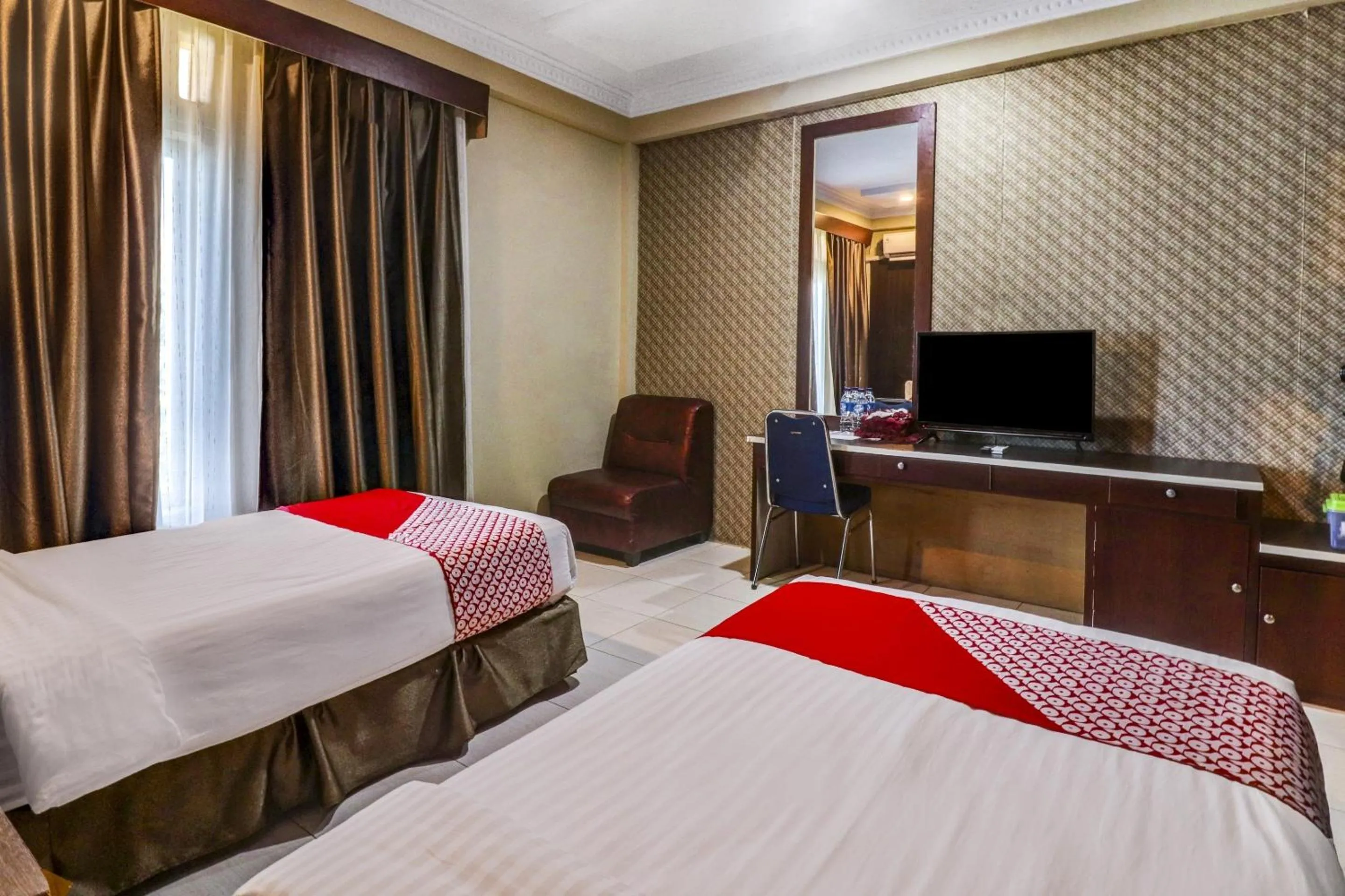 Bedroom in Collection O 90564 Hotel Merangin Syariah