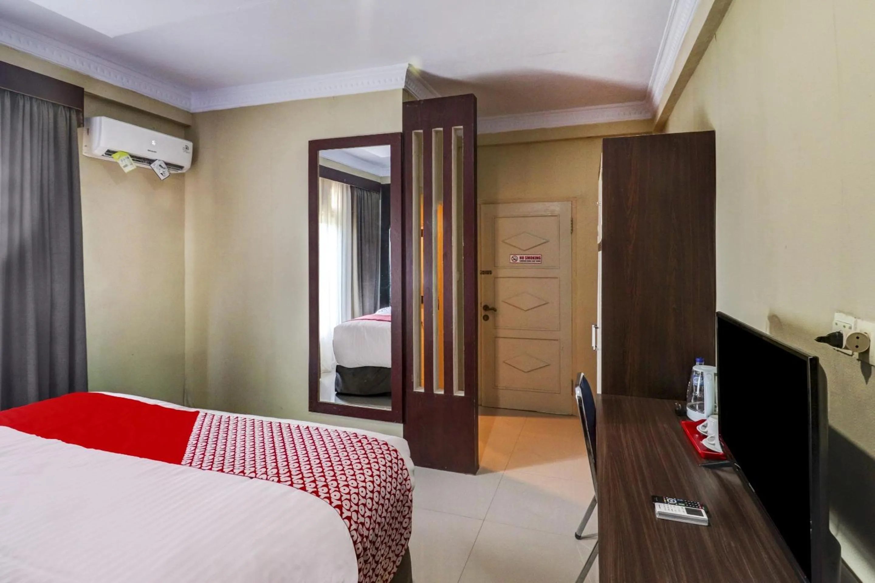 Bedroom in Collection O 90564 Hotel Merangin Syariah