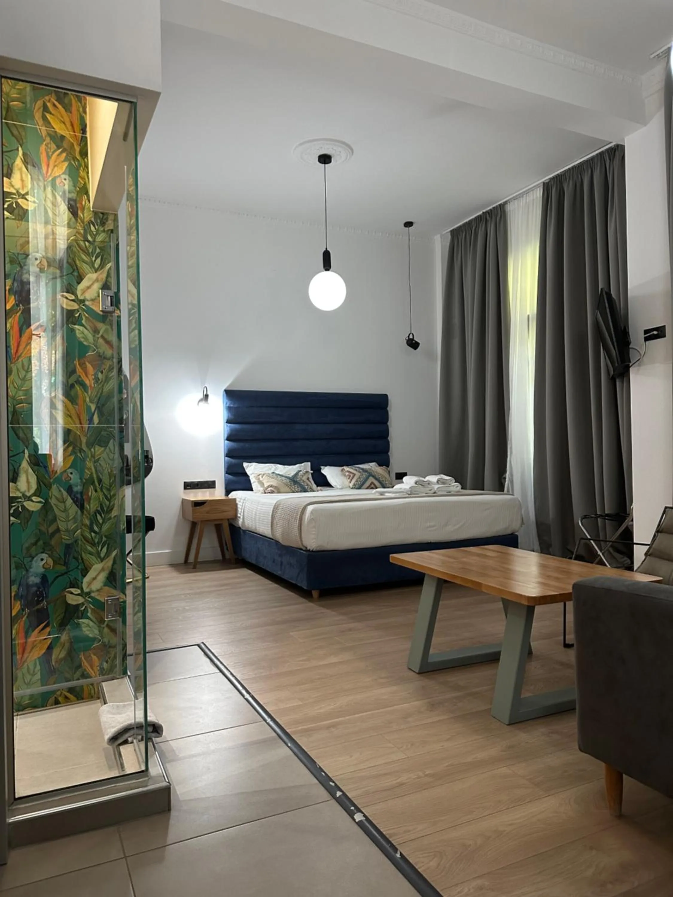 Shower, Bed in The Maroon Bottle Luxury Suites