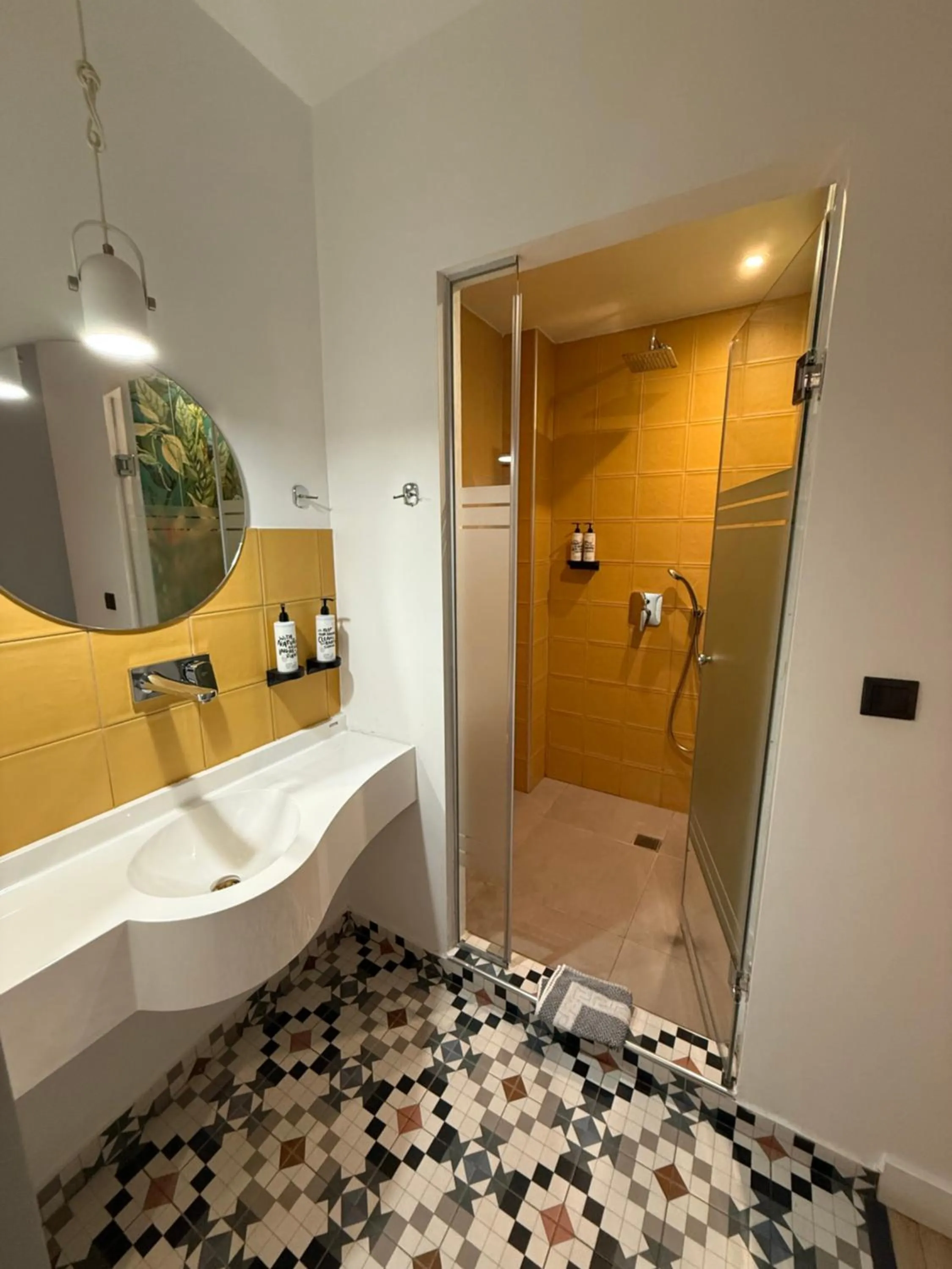 Shower in The Maroon Bottle Luxury Suites