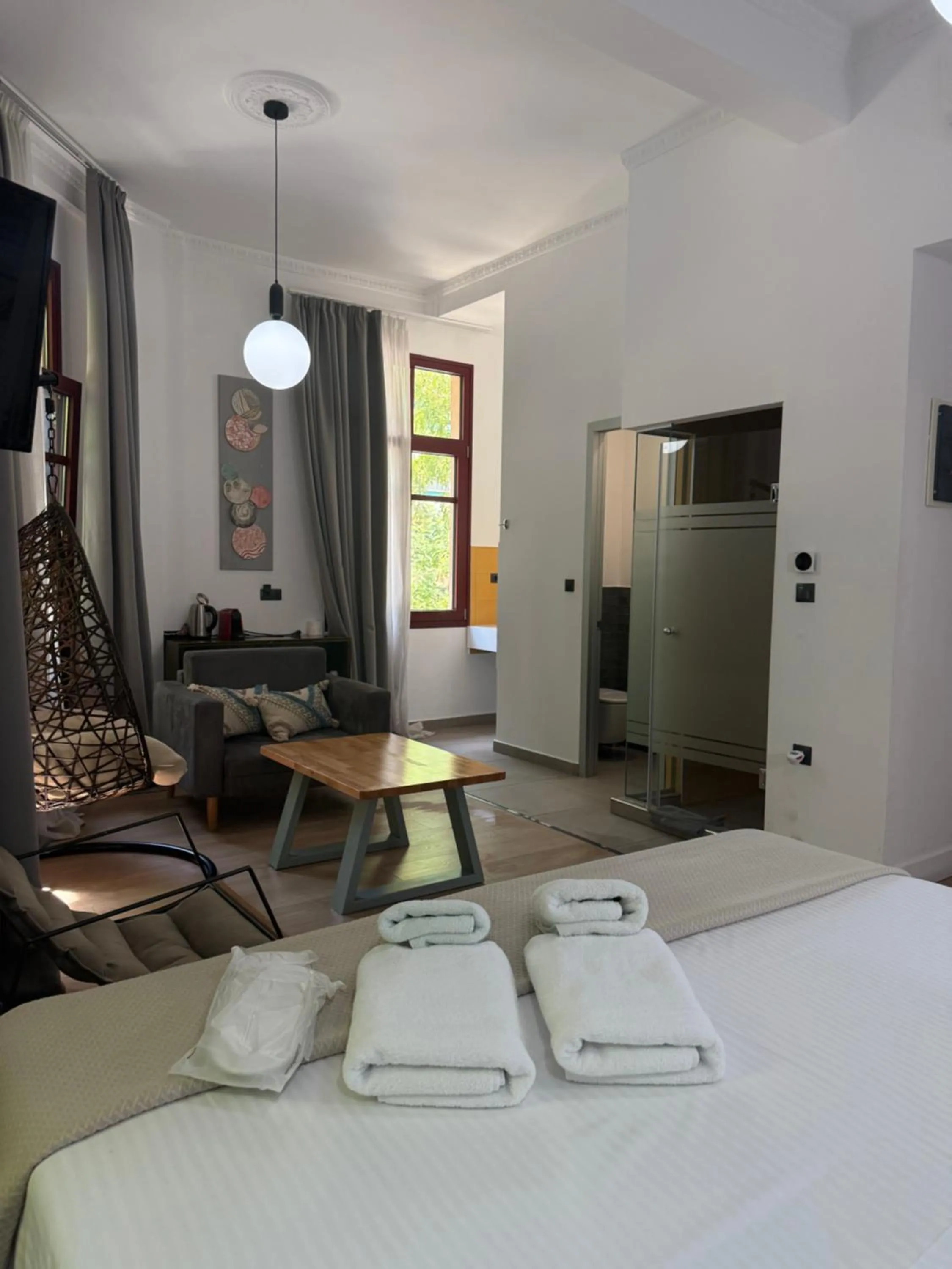 Shower, Bed in The Maroon Bottle Luxury Suites