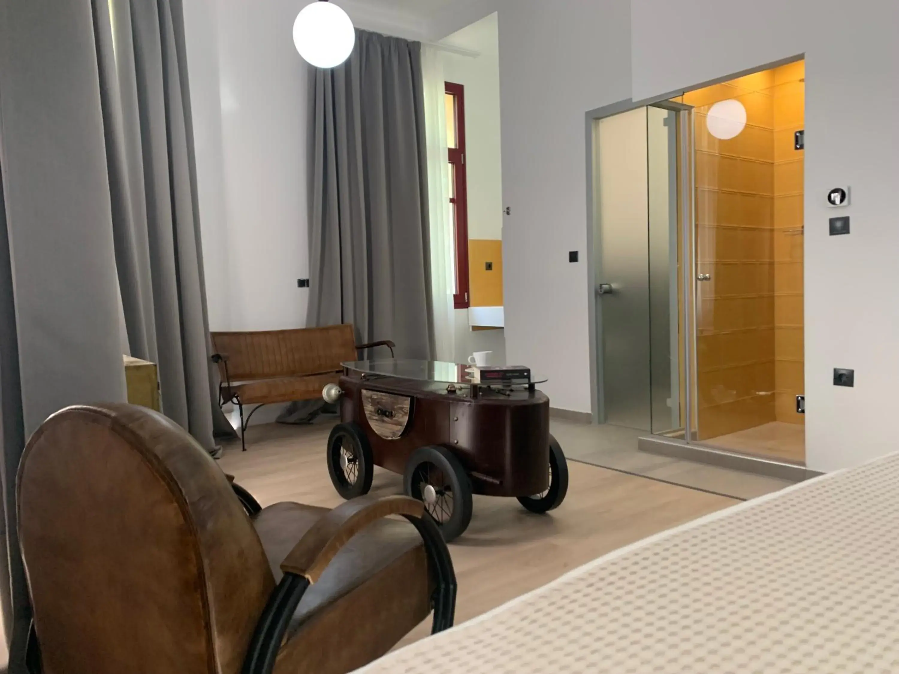 Deluxe King Suite with Balcony in The Maroon Bottle Luxury Suites Deluxe King Suite with Balcony in The Maroon Bottle Luxury Suites