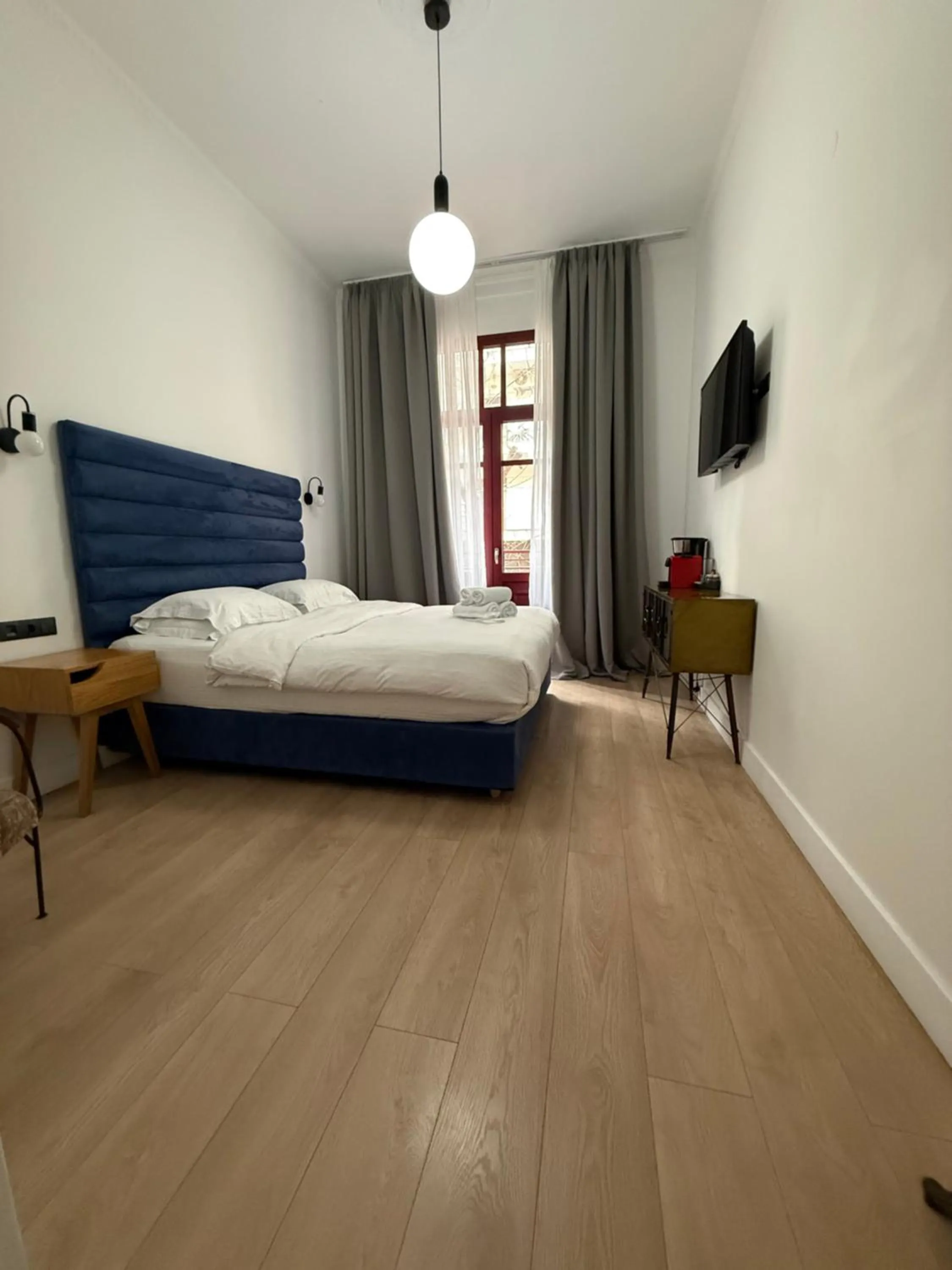 Bed in The Maroon Bottle Luxury Suites