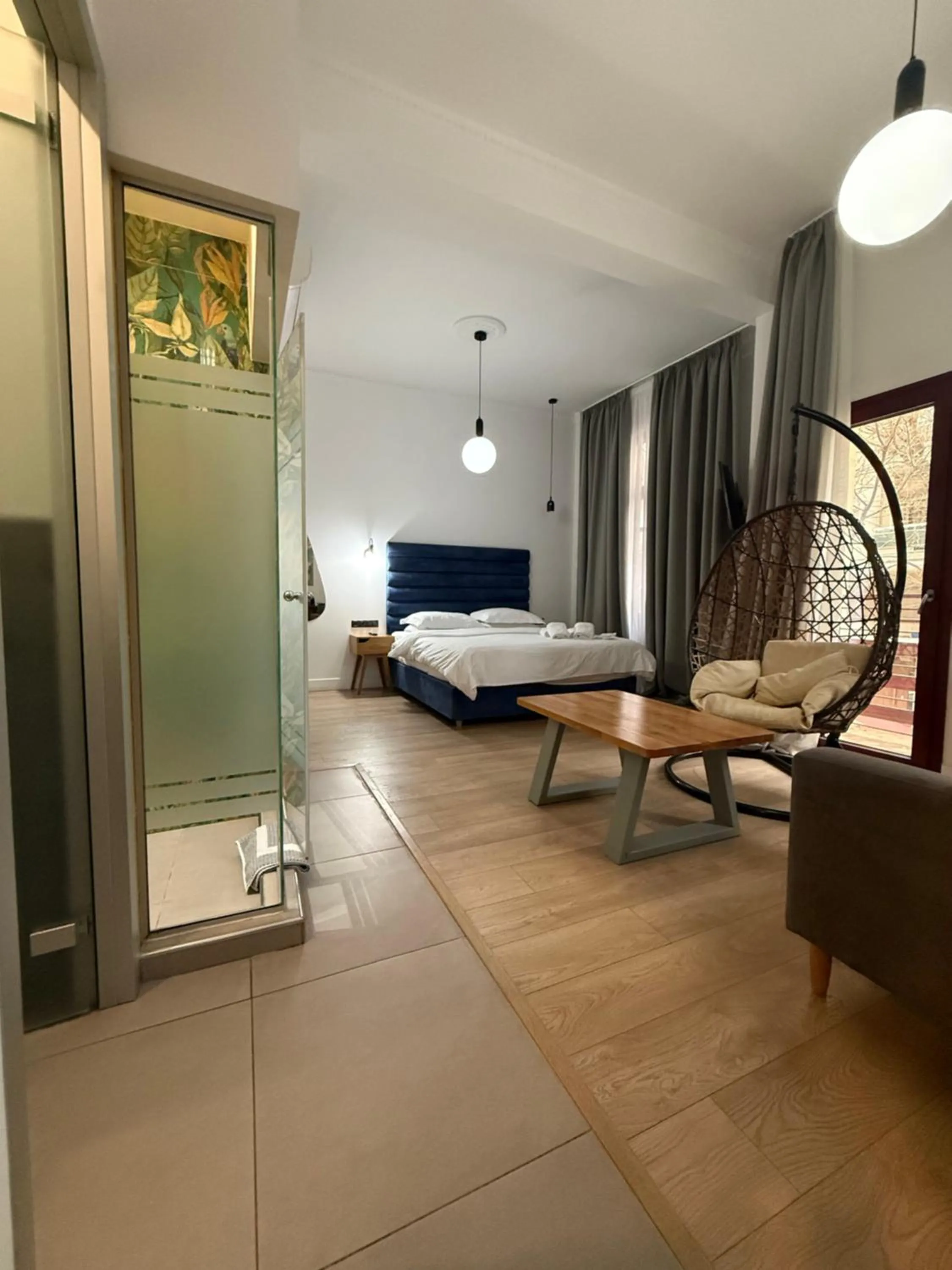 Shower in The Maroon Bottle Luxury Suites