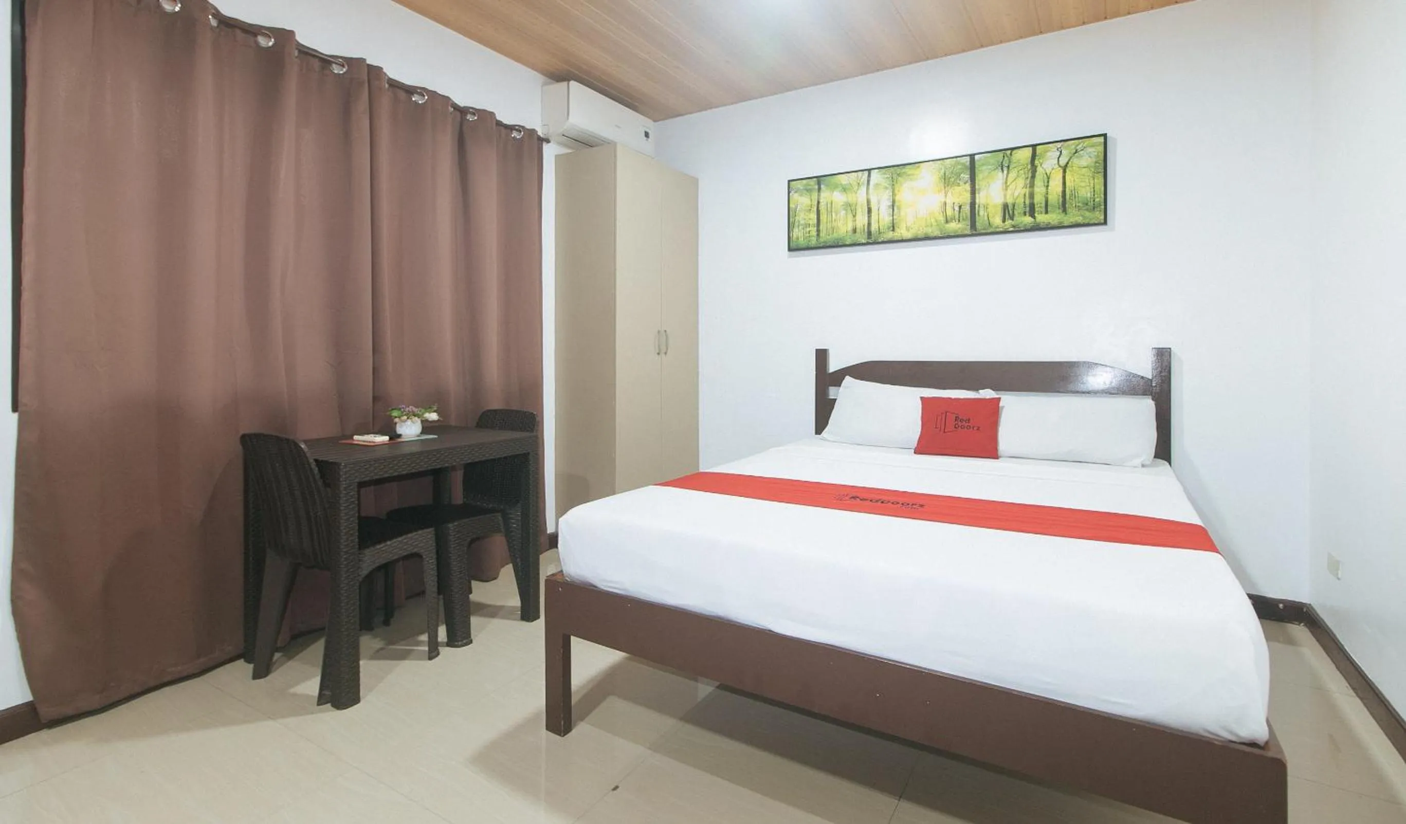 Photo of the whole room, Bed in RedDoorz at RJs Bldg near Lyceum Gen Trias Cavite