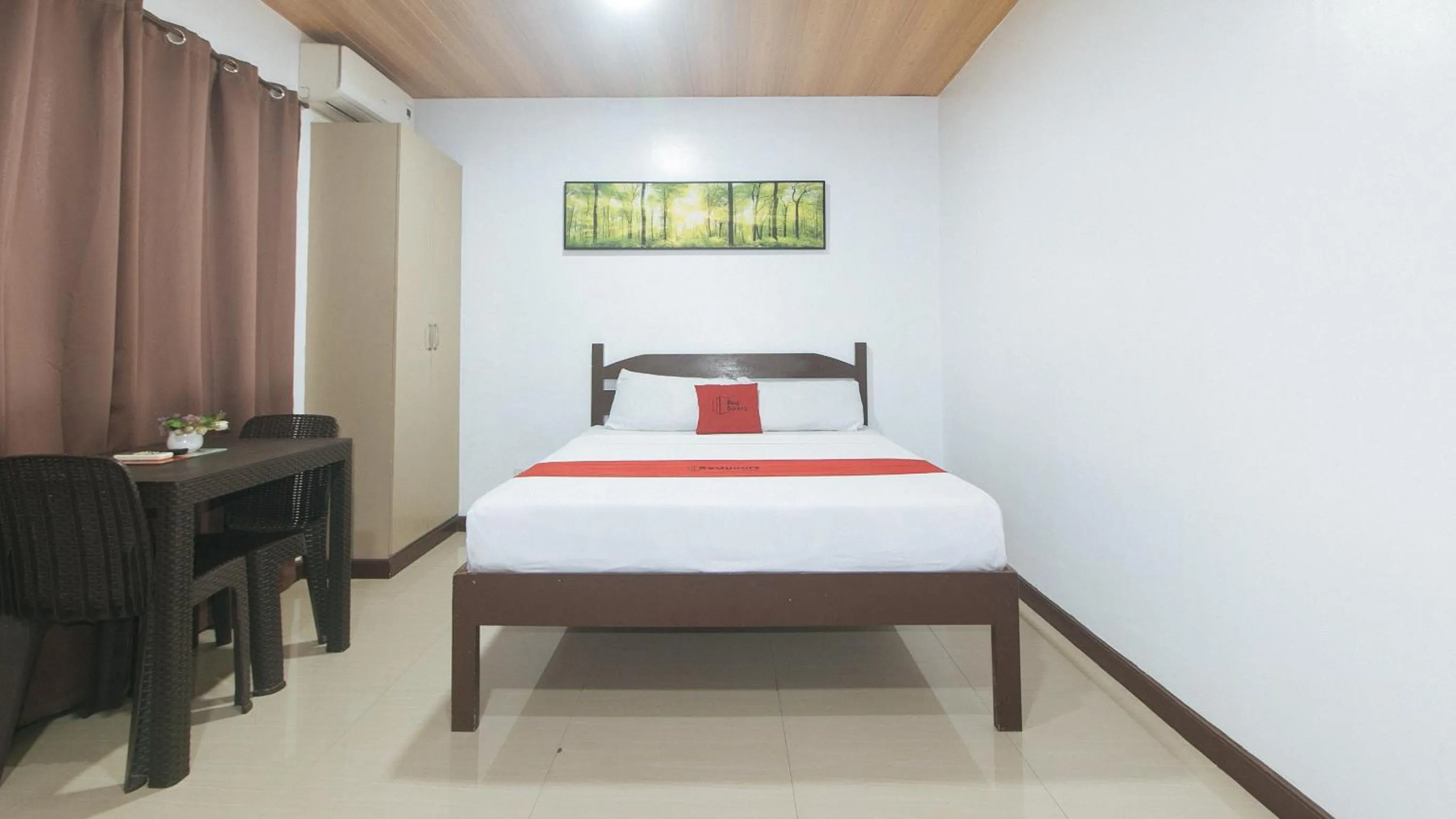 Photo of the whole room, Bed in RedDoorz at RJs Bldg near Lyceum Gen Trias Cavite
