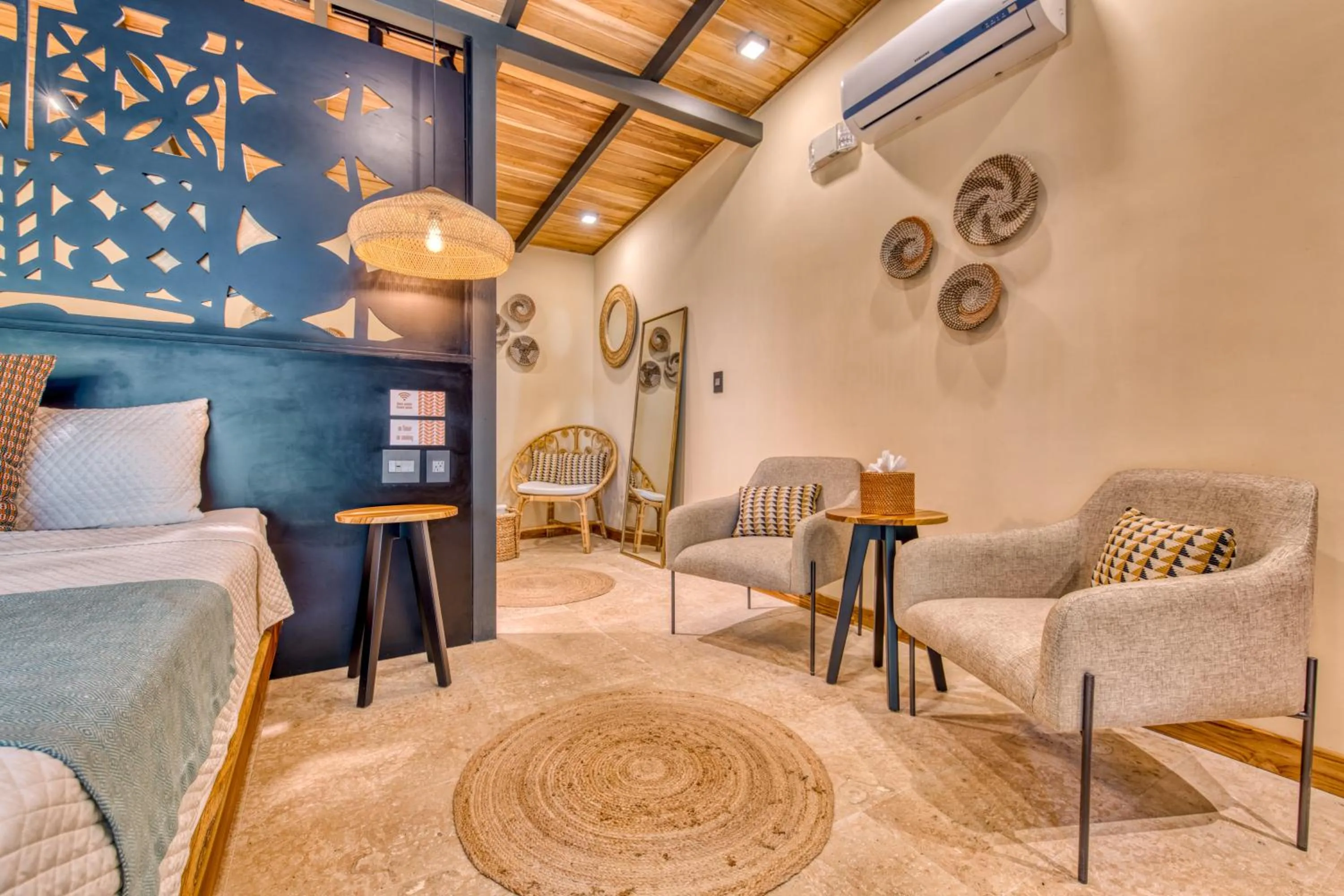 Seating area, Bed in awā Beachfront Hotel