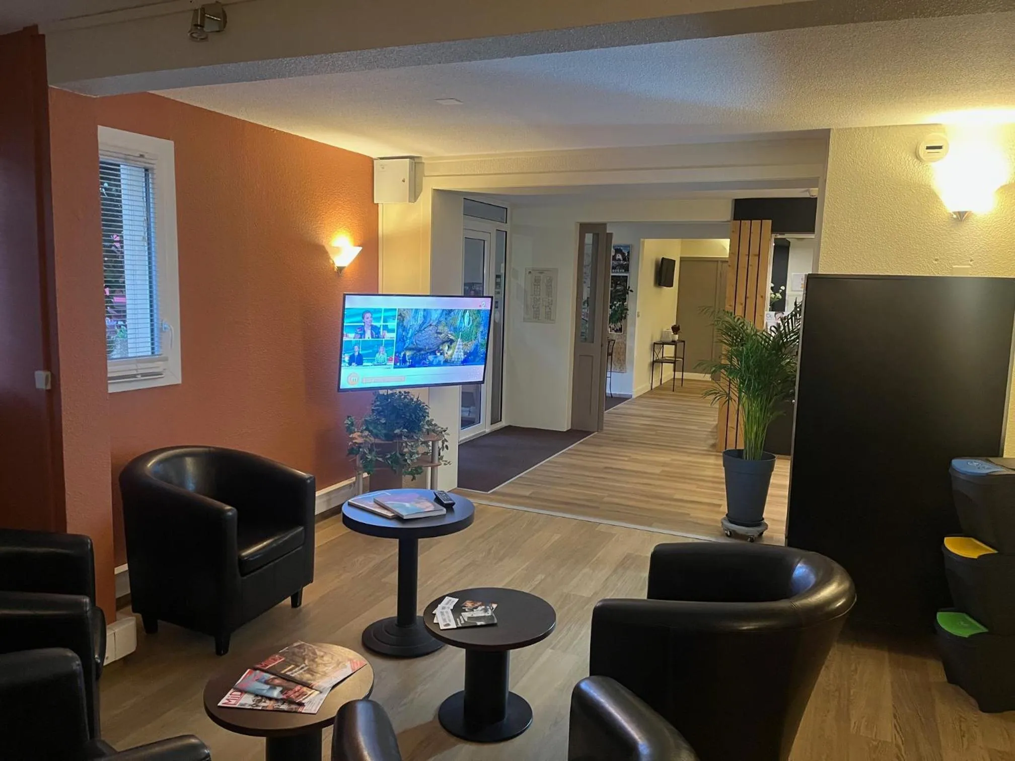 Communal lounge/ TV room in Brit Hotel Confort Deltour Mende