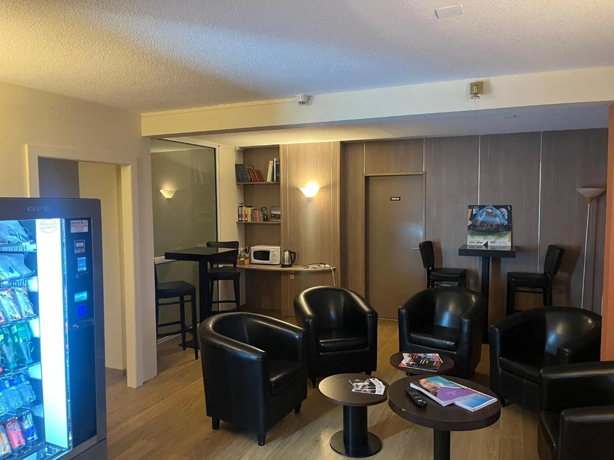 Communal lounge/ TV room in Brit Hotel Confort Deltour Mende