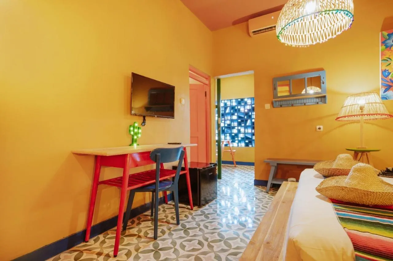 Bed in Por Aqui Stay & Dine