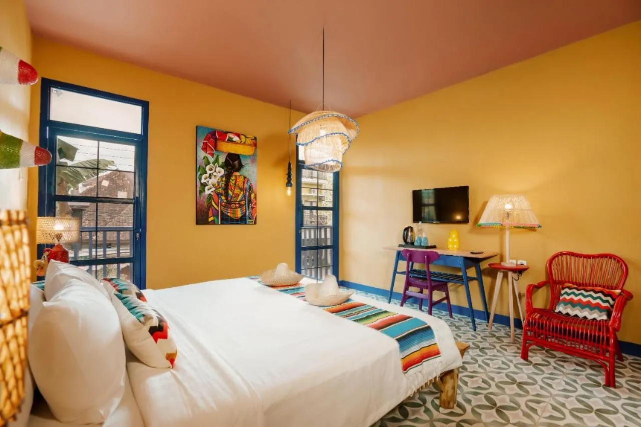 Bed in Por Aqui Stay & Dine