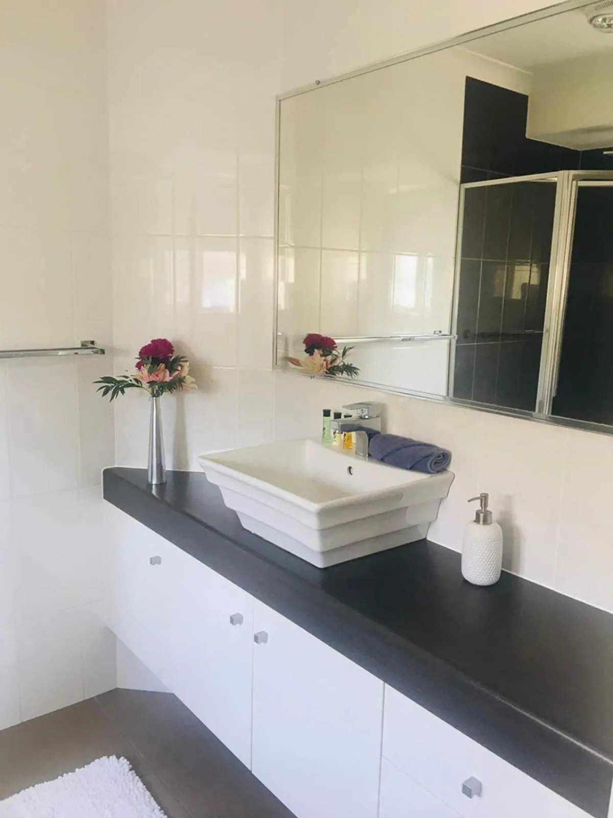 Bathroom in Bundys Best! Modern Luxury in the heart of town