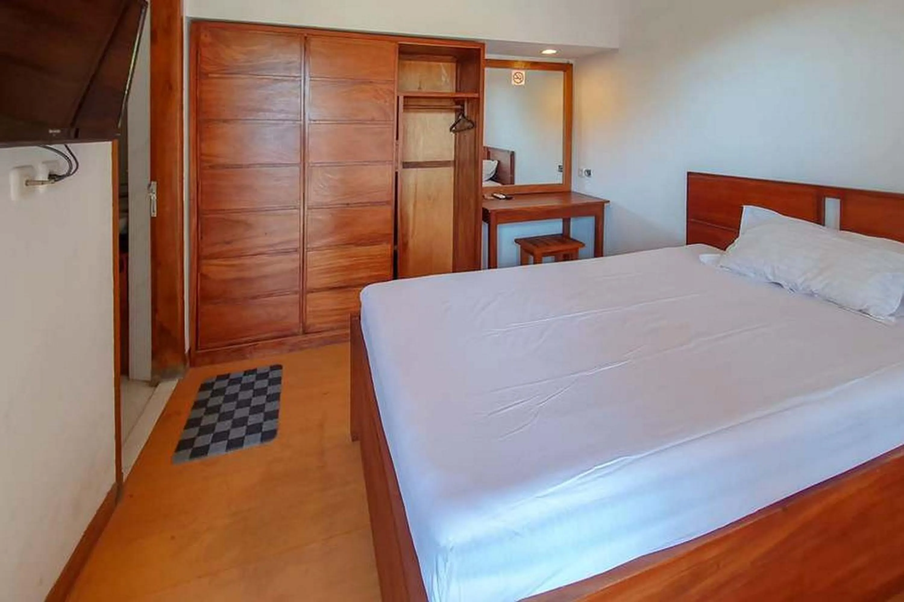 Bed in Rumah Eyang Tardjo Syariah Mitra RedDoorz