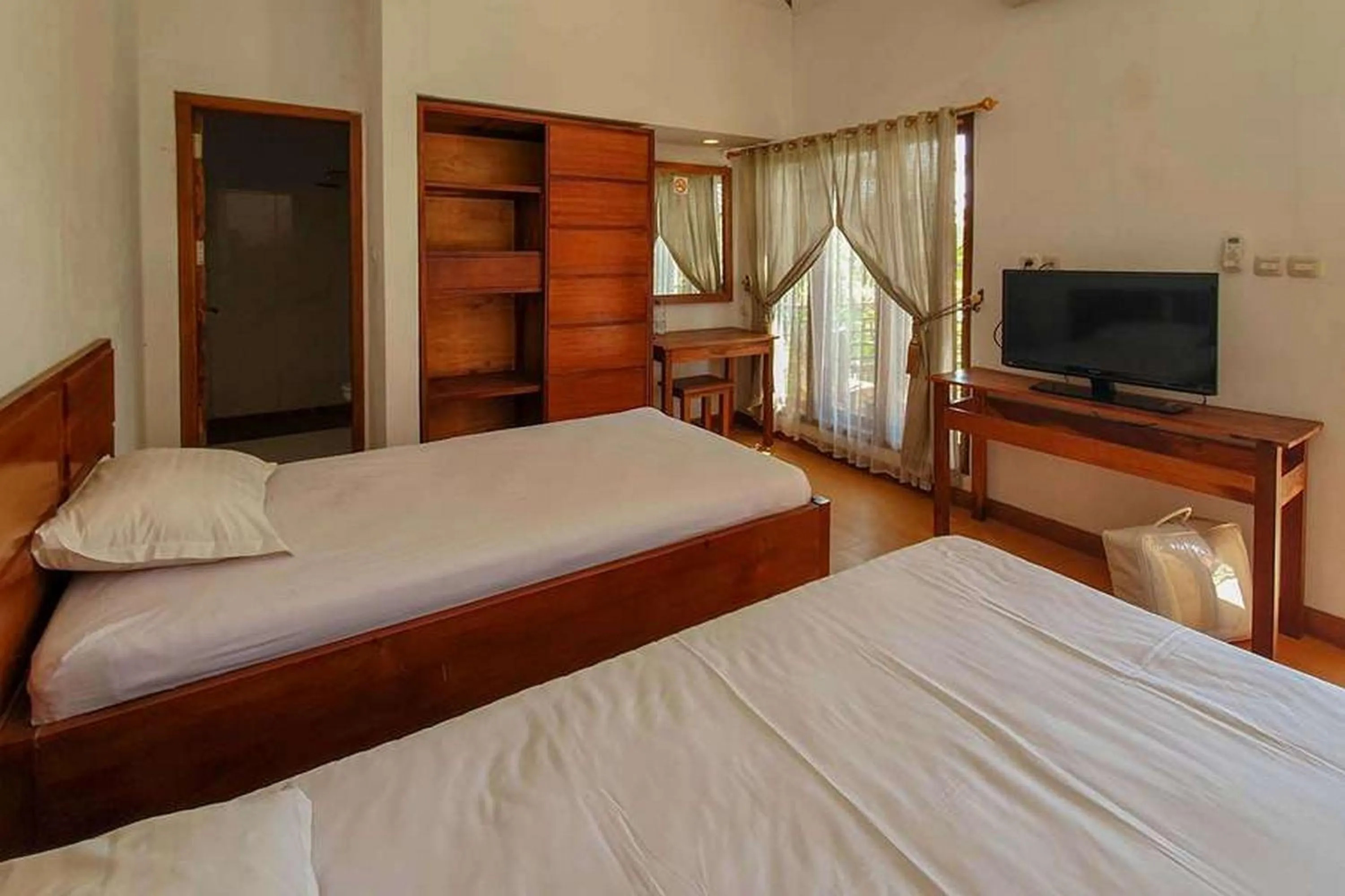 Bed in Rumah Eyang Tardjo Syariah Mitra RedDoorz