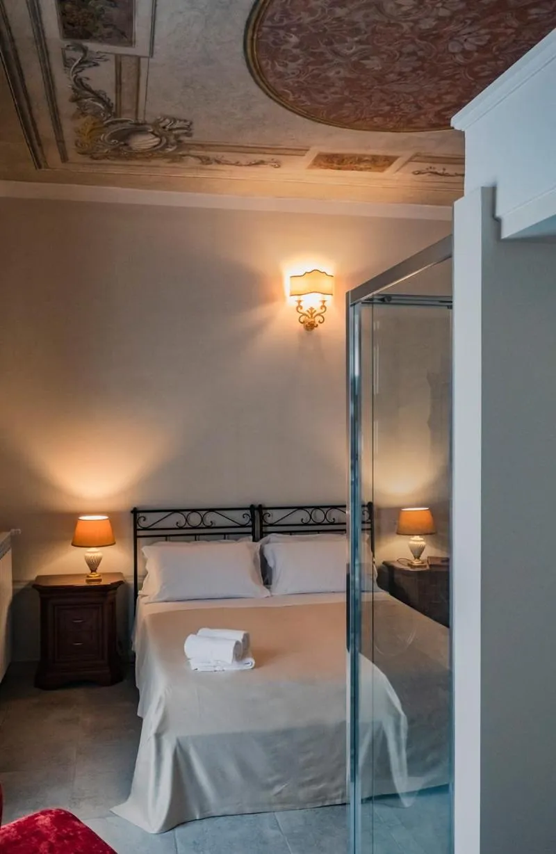 Photo of the whole room, Bed in Palazzo dei Pavoni, Relais di Charme