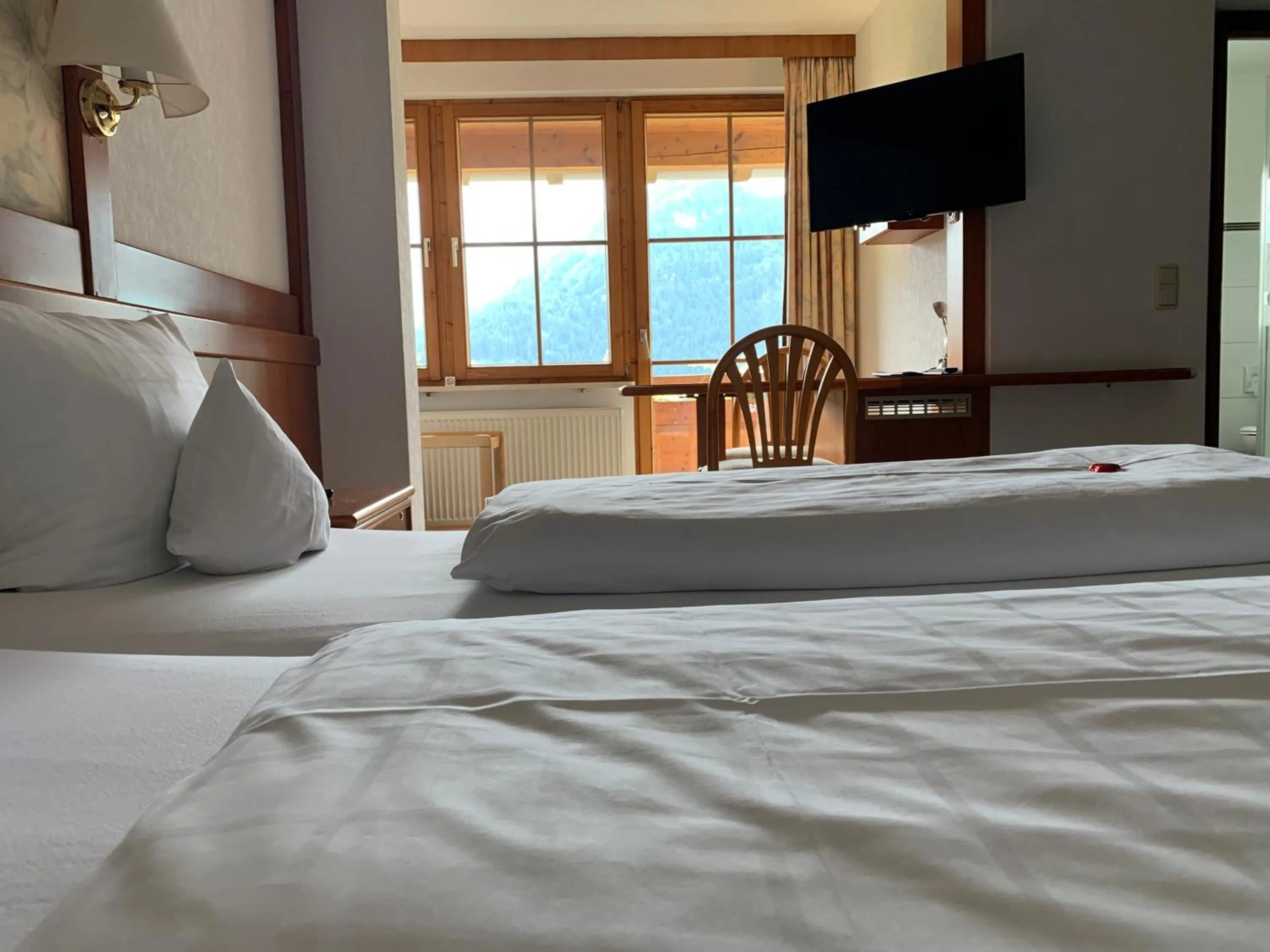 Photo of the whole room, Bed in Alpenhotel Sonneck - mit Bergbahnticket