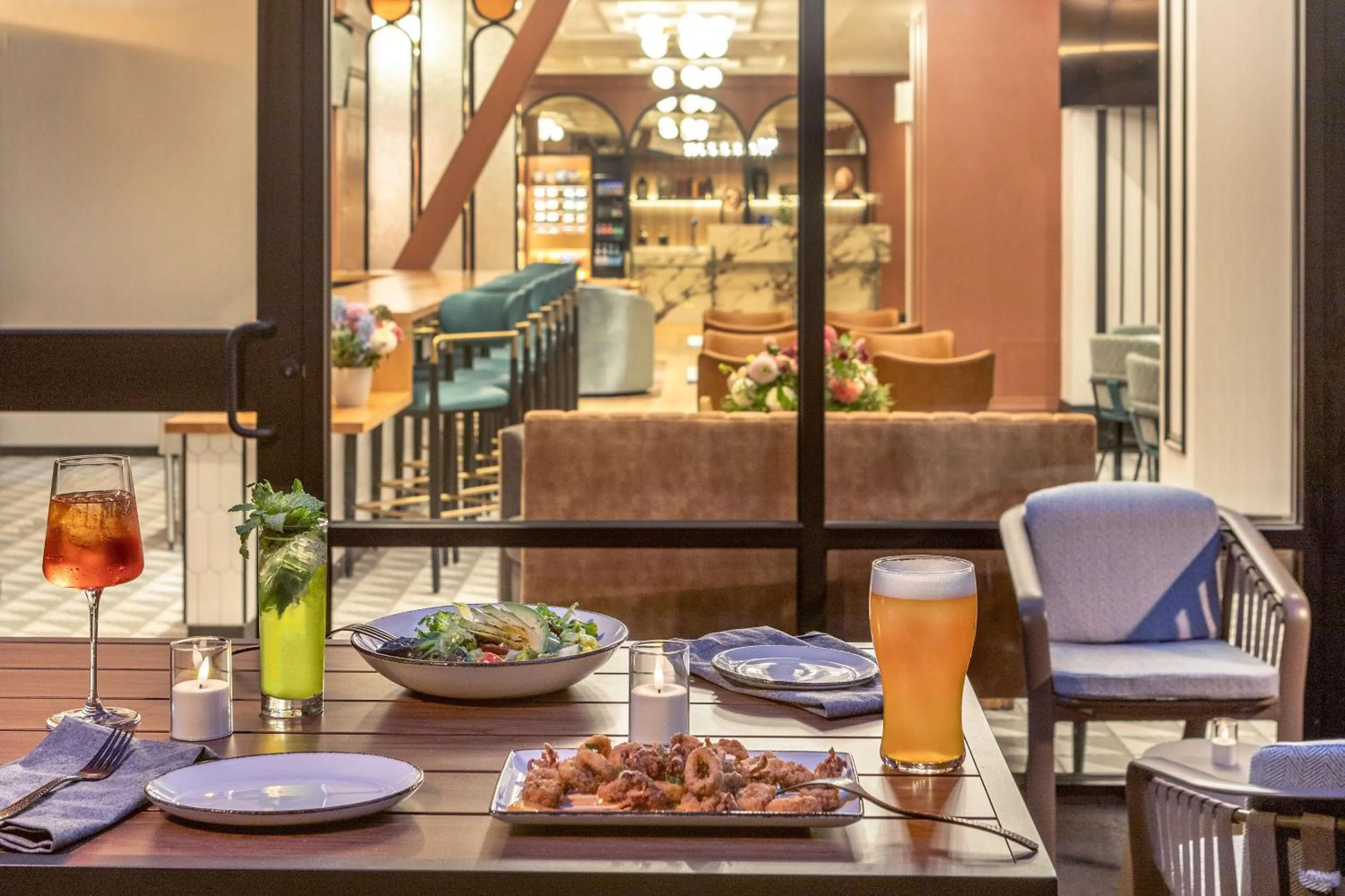 Patio in Pennyweight Hotel Boston, Curio Collection by Hilton