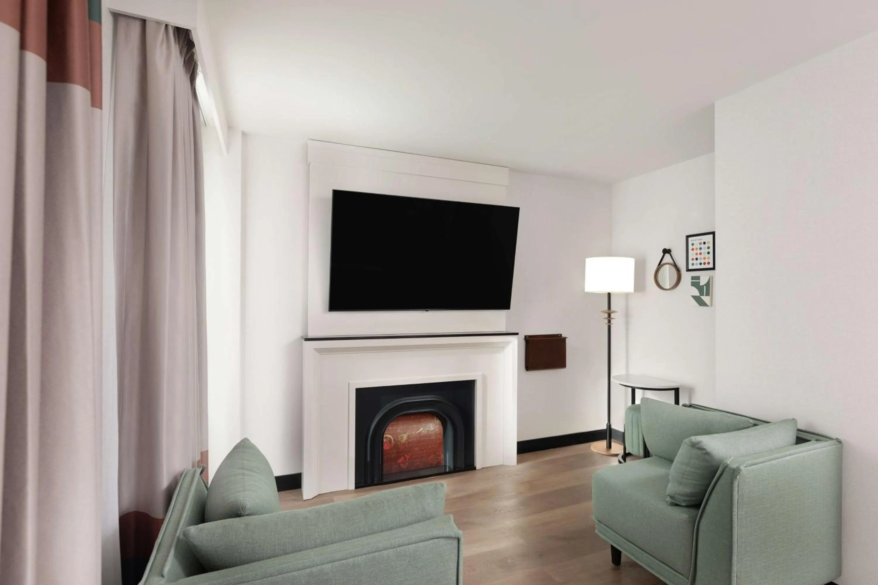 Living room in Pennyweight Hotel Boston, Curio Collection by Hilton