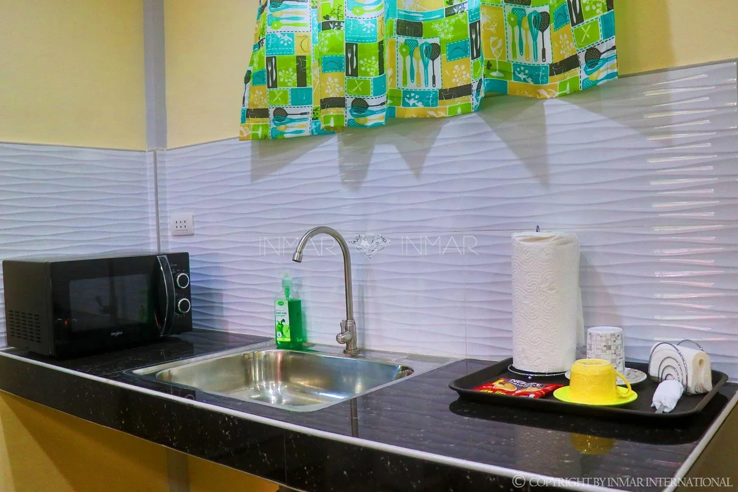 Kitchen or kitchenette in AJ Residences Apartelle