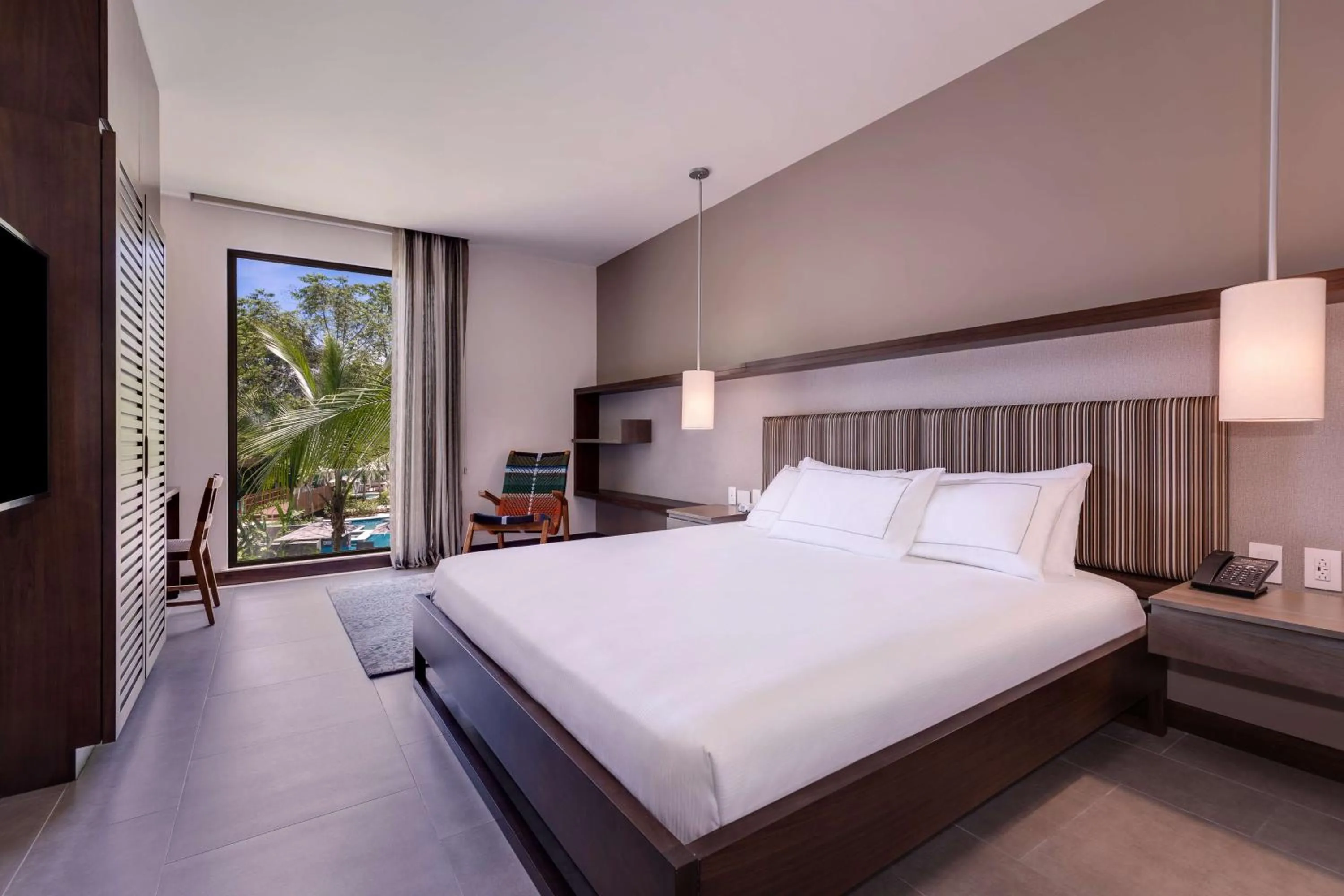 Bed in Botanika Osa Peninsula, Curio Collection By Hilton