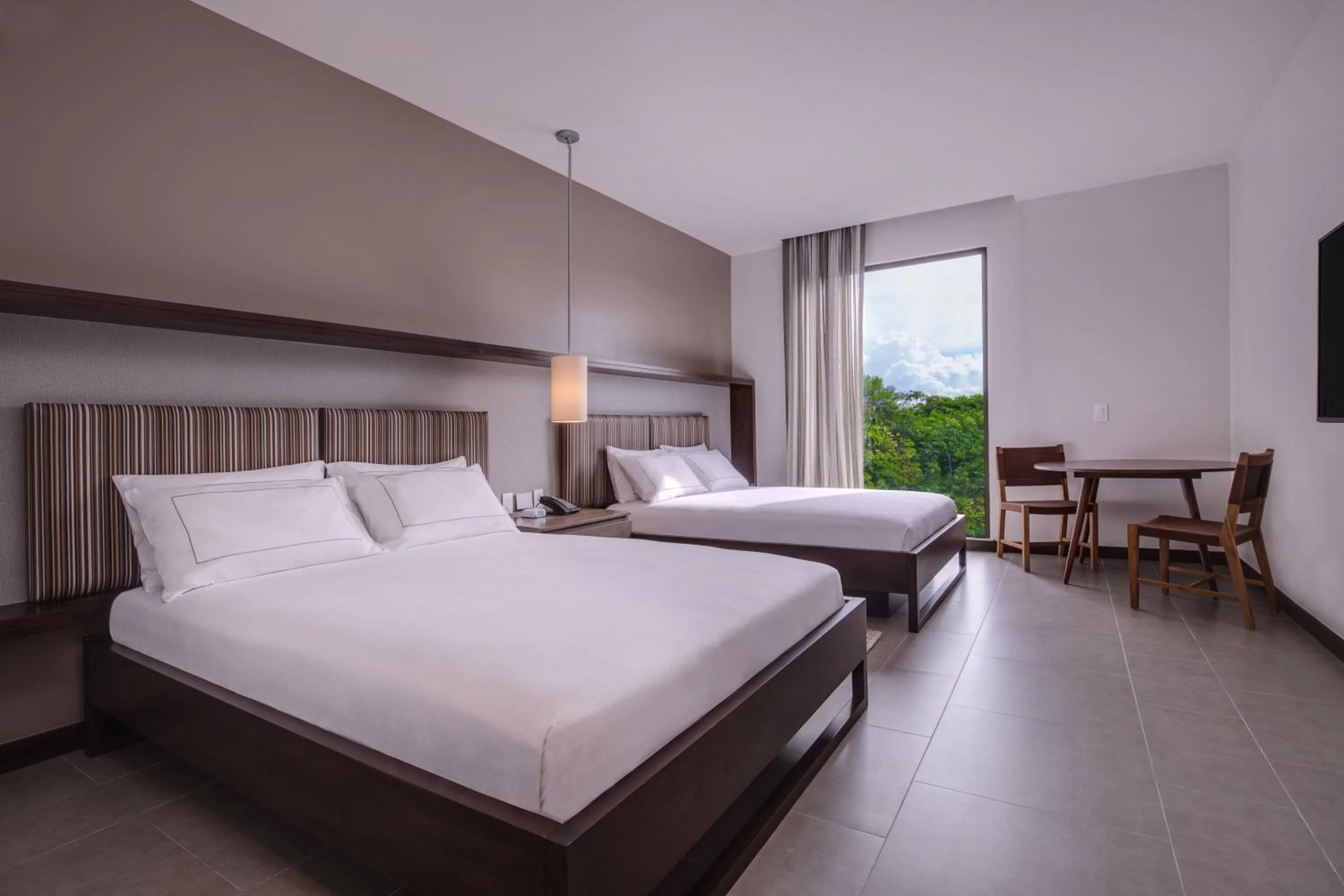 Bed in Botanika Osa Peninsula, Curio Collection By Hilton
