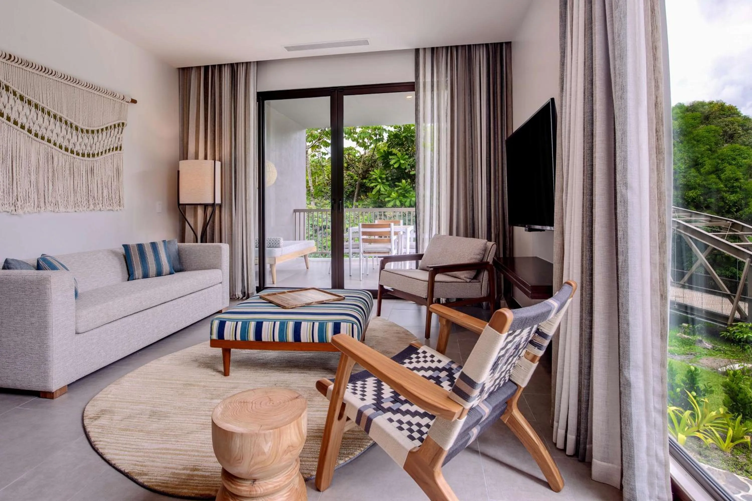 Living room in Botanika Osa Peninsula, Curio Collection By Hilton