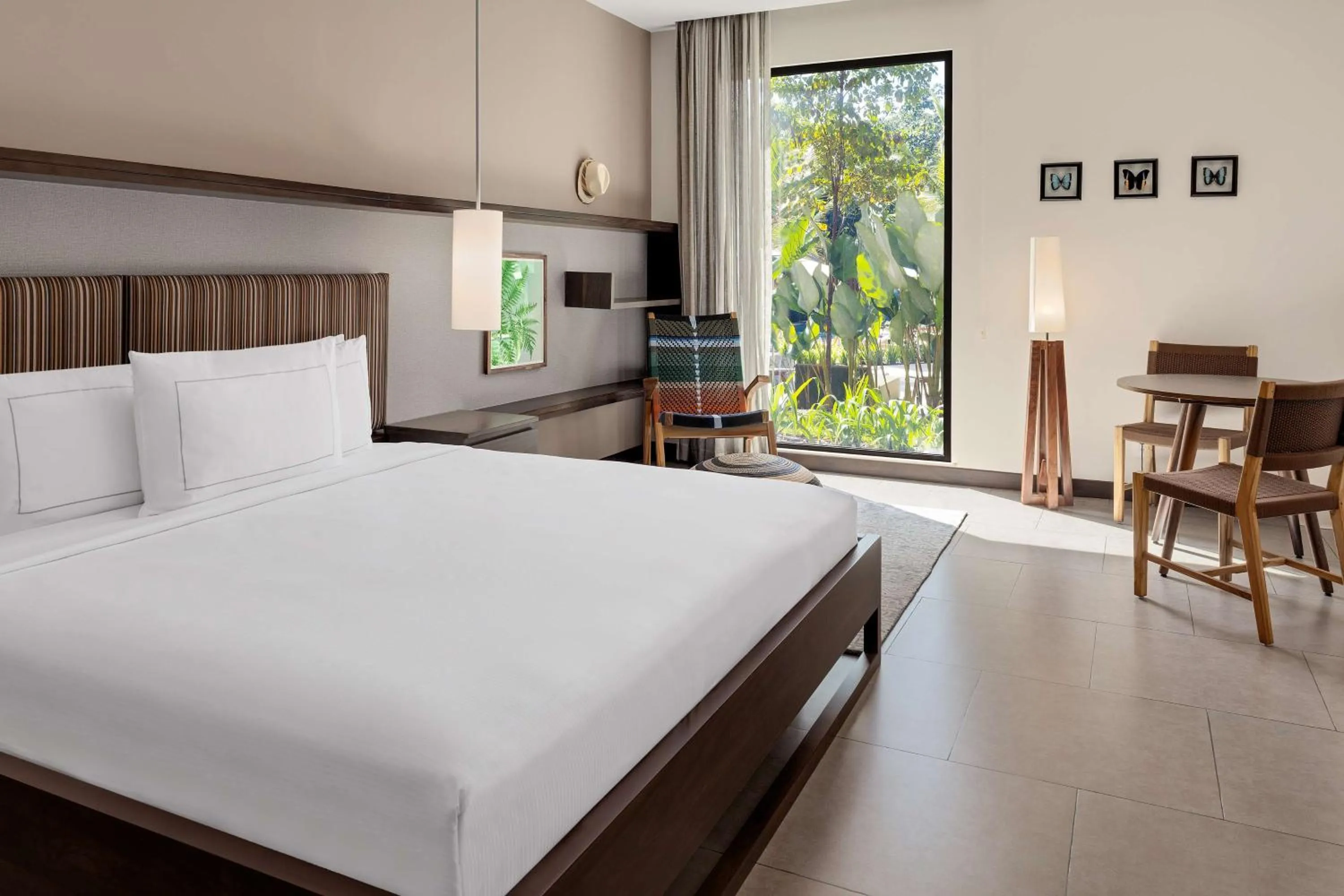 Bed in Botanika Osa Peninsula, Curio Collection By Hilton