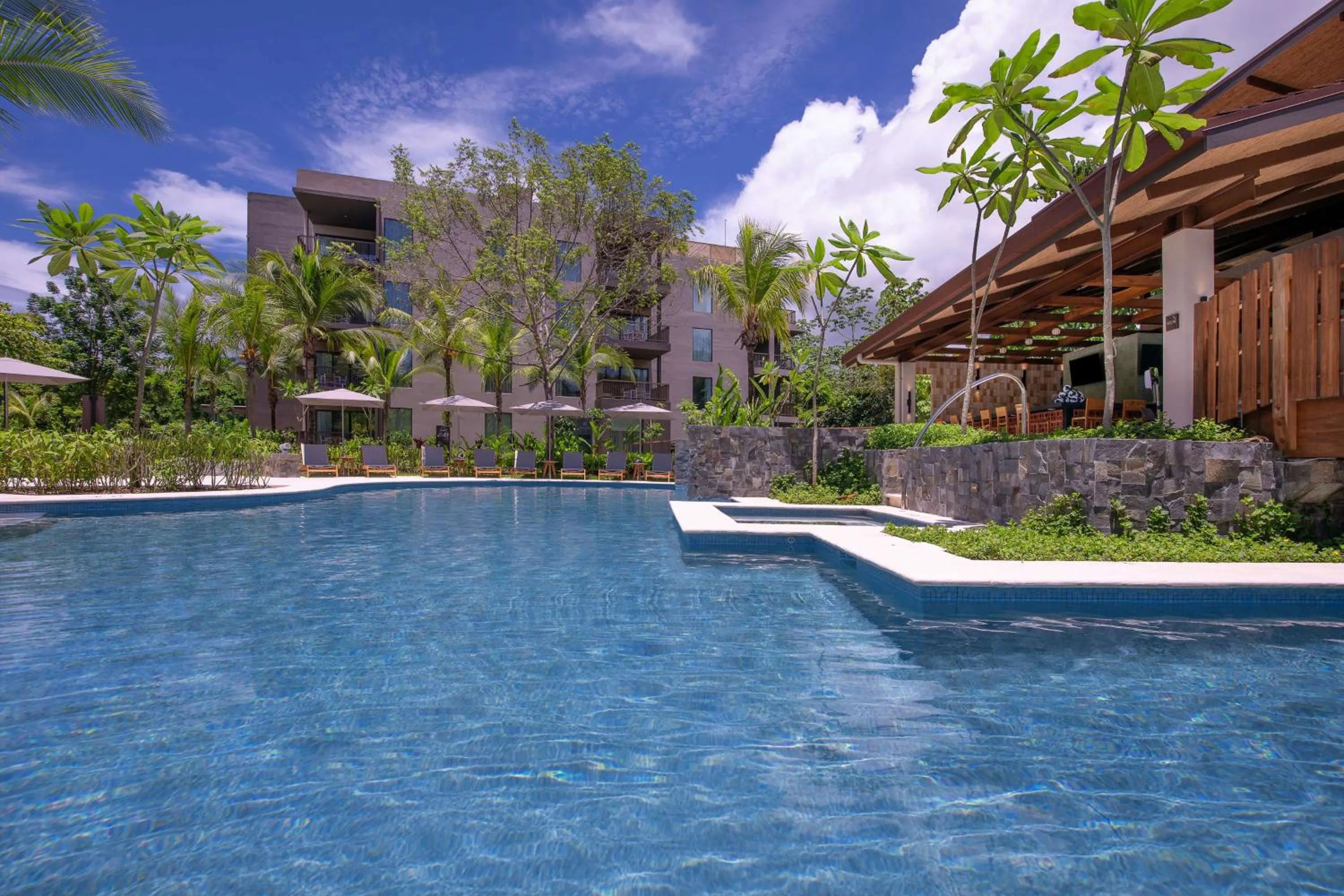 Pool view in Botanika Osa Peninsula, Curio Collection By Hilton