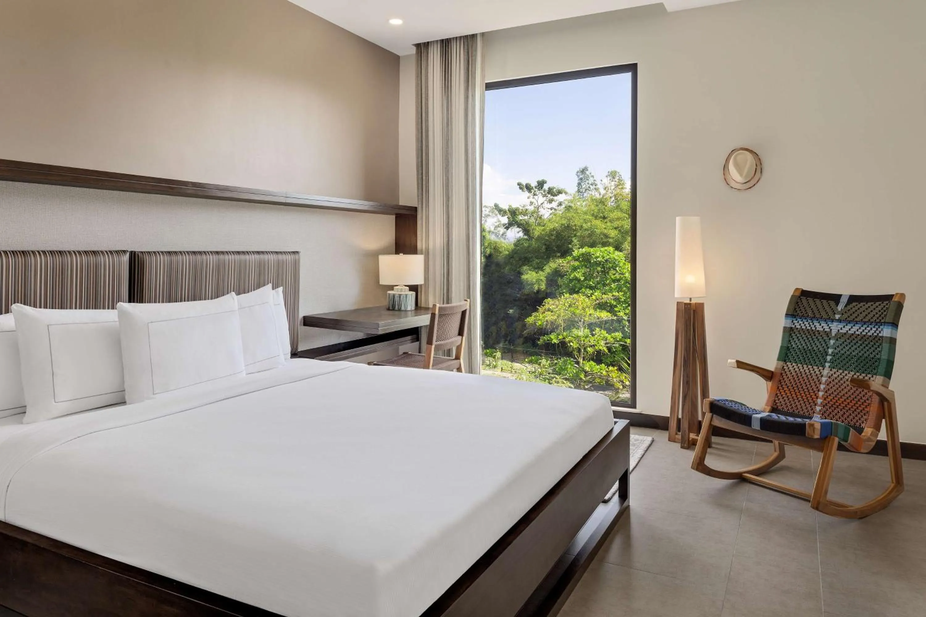 Bed in Botanika Osa Peninsula, Curio Collection By Hilton
