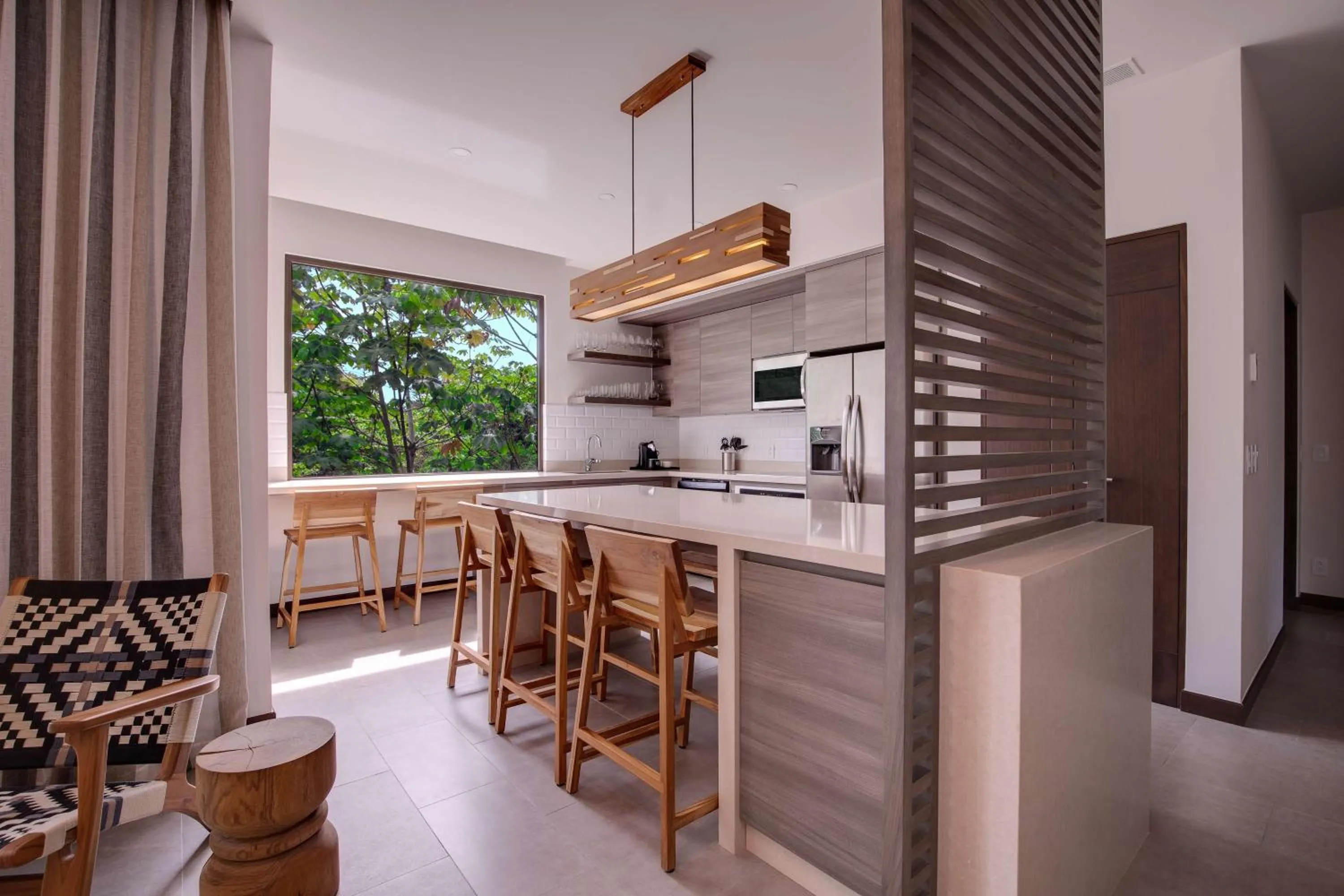 Kitchen or kitchenette in Botanika Osa Peninsula, Curio Collection By Hilton