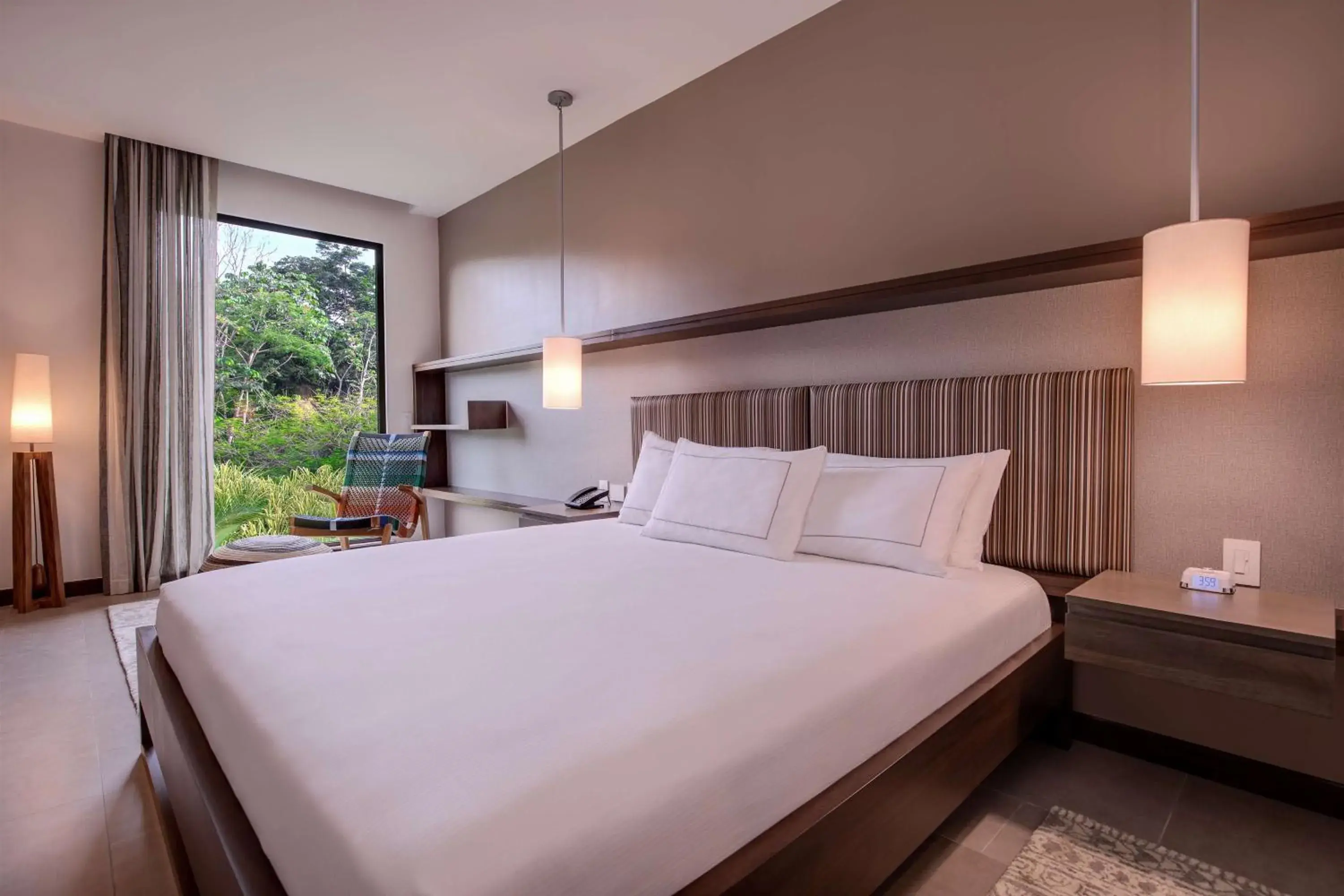 Bed in Botanika Osa Peninsula, Curio Collection By Hilton Bed in Botanika Osa Peninsula, Curio Collection By Hilton
