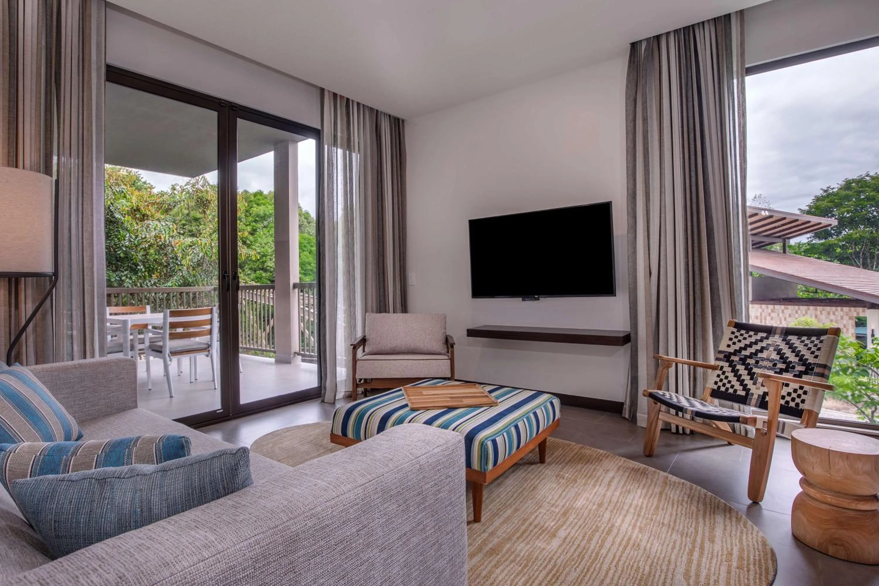 Living room in Botanika Osa Peninsula, Curio Collection By Hilton