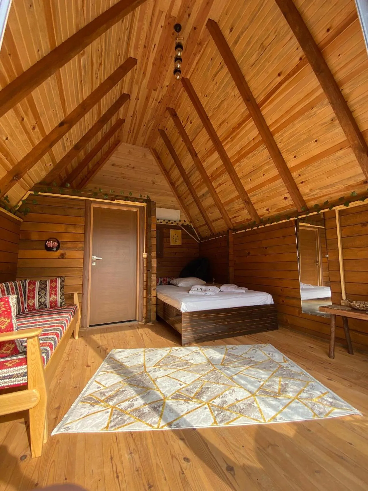 Seating area, Bed in Oce Bungalow