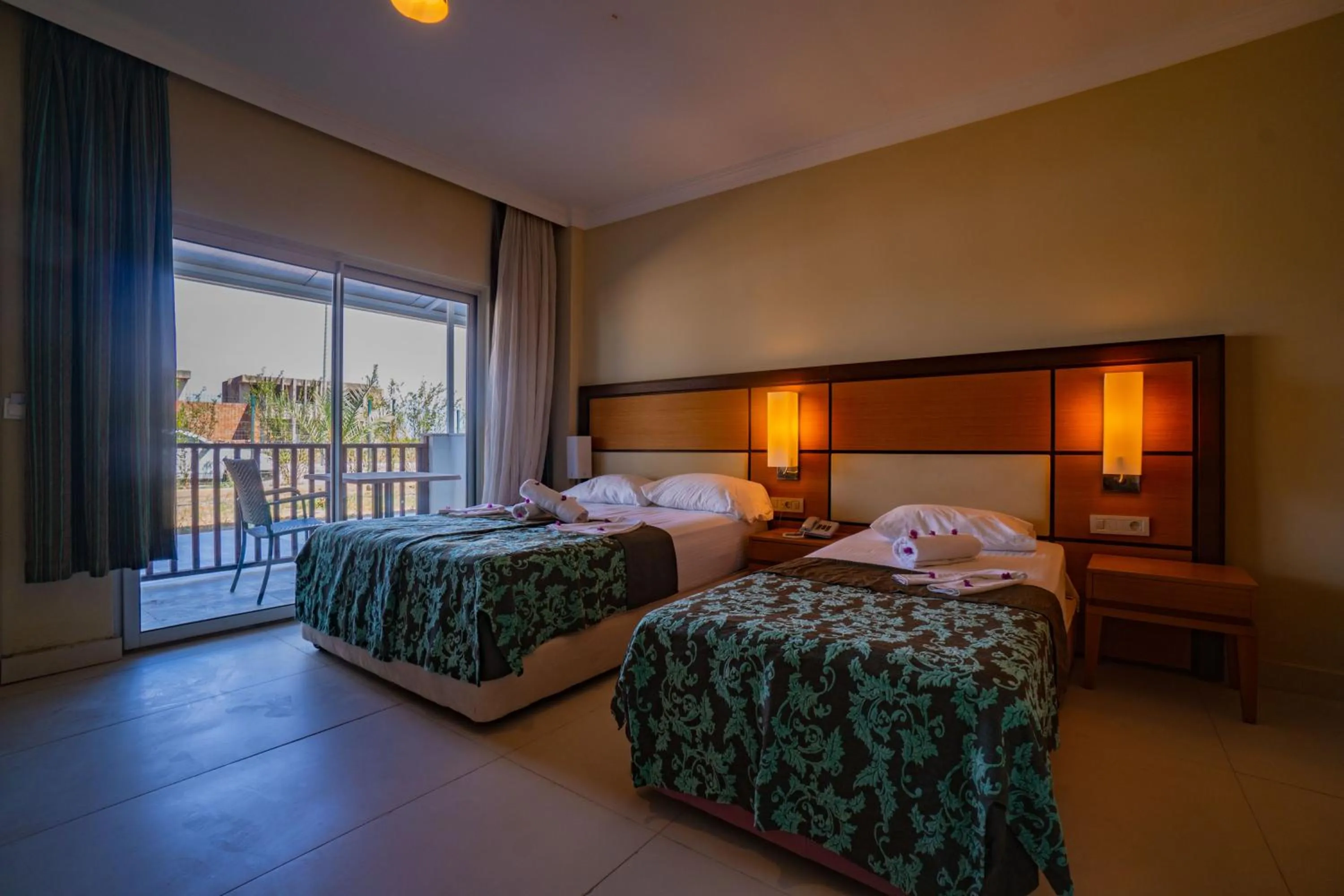 Bed in Prenses Sealine Beach Hotel